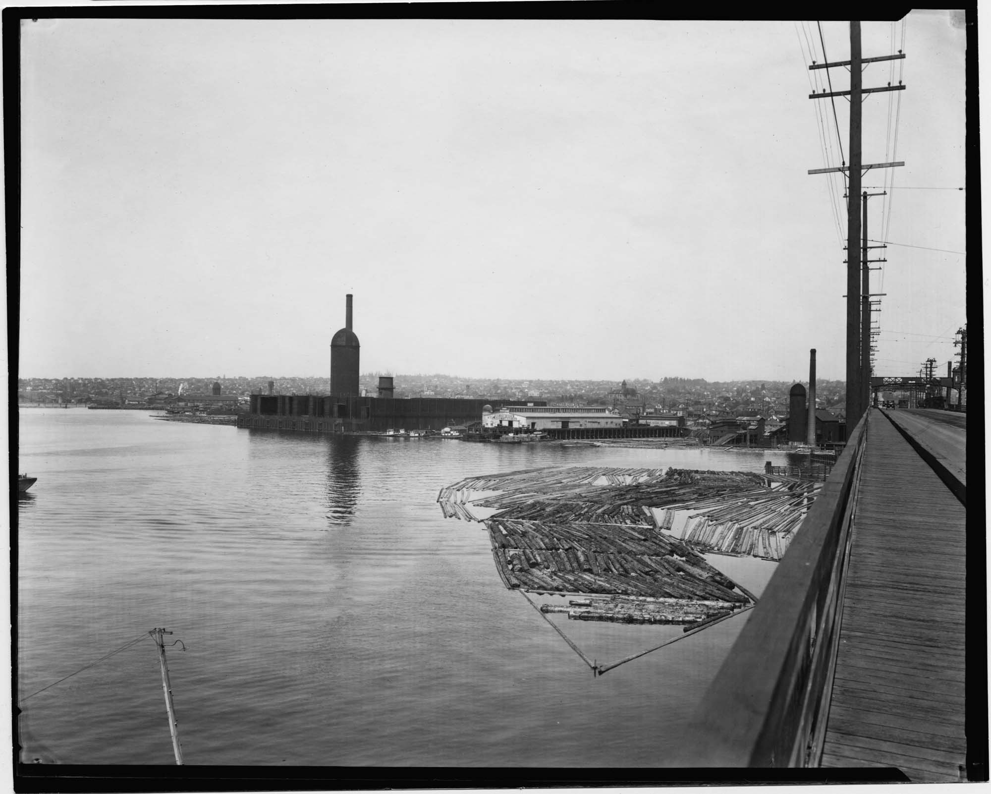Image of Log rafts near Ballard Bridge, Seattle, circa 1919