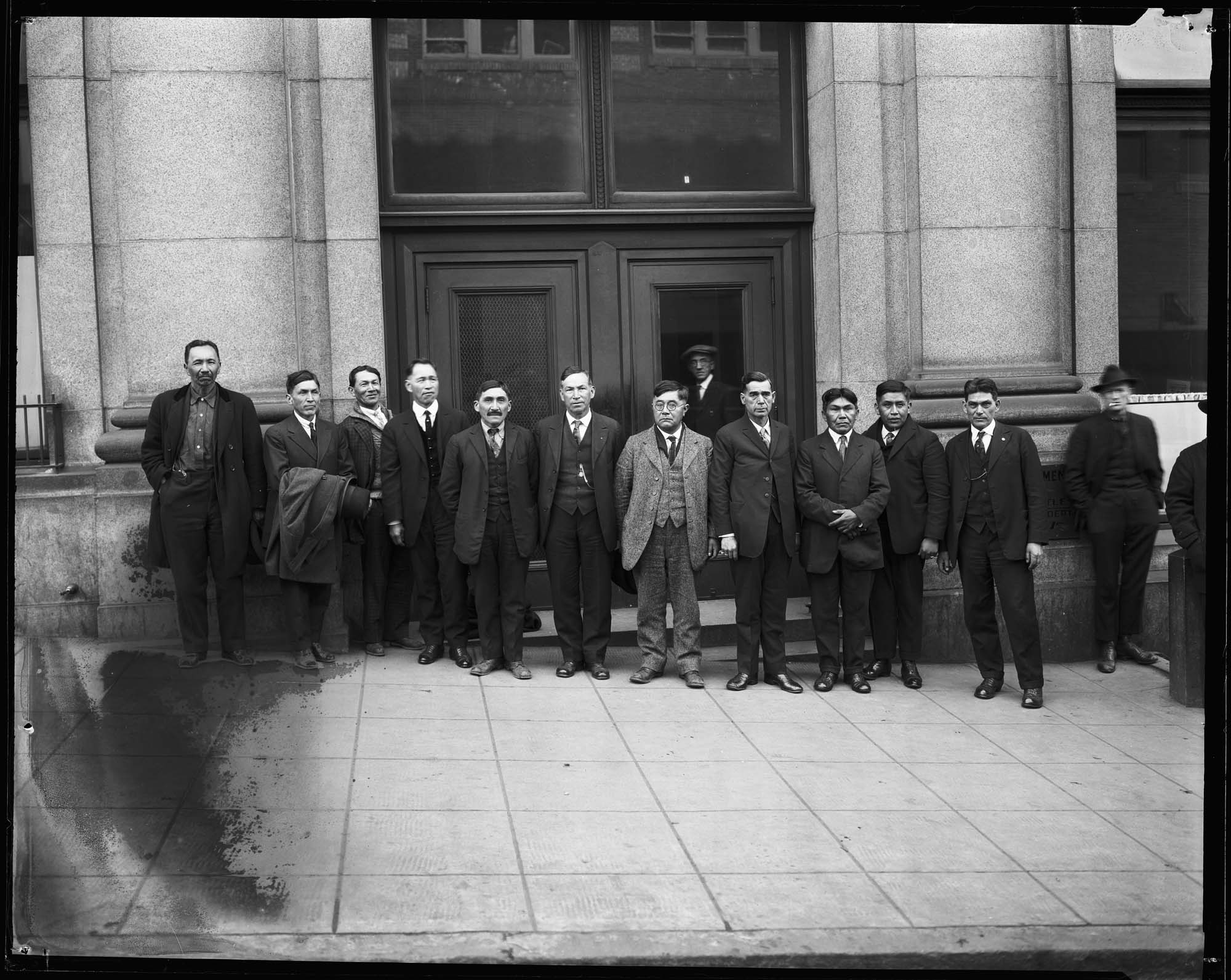 Image of Group of Native American men at courthouse, circa 1920