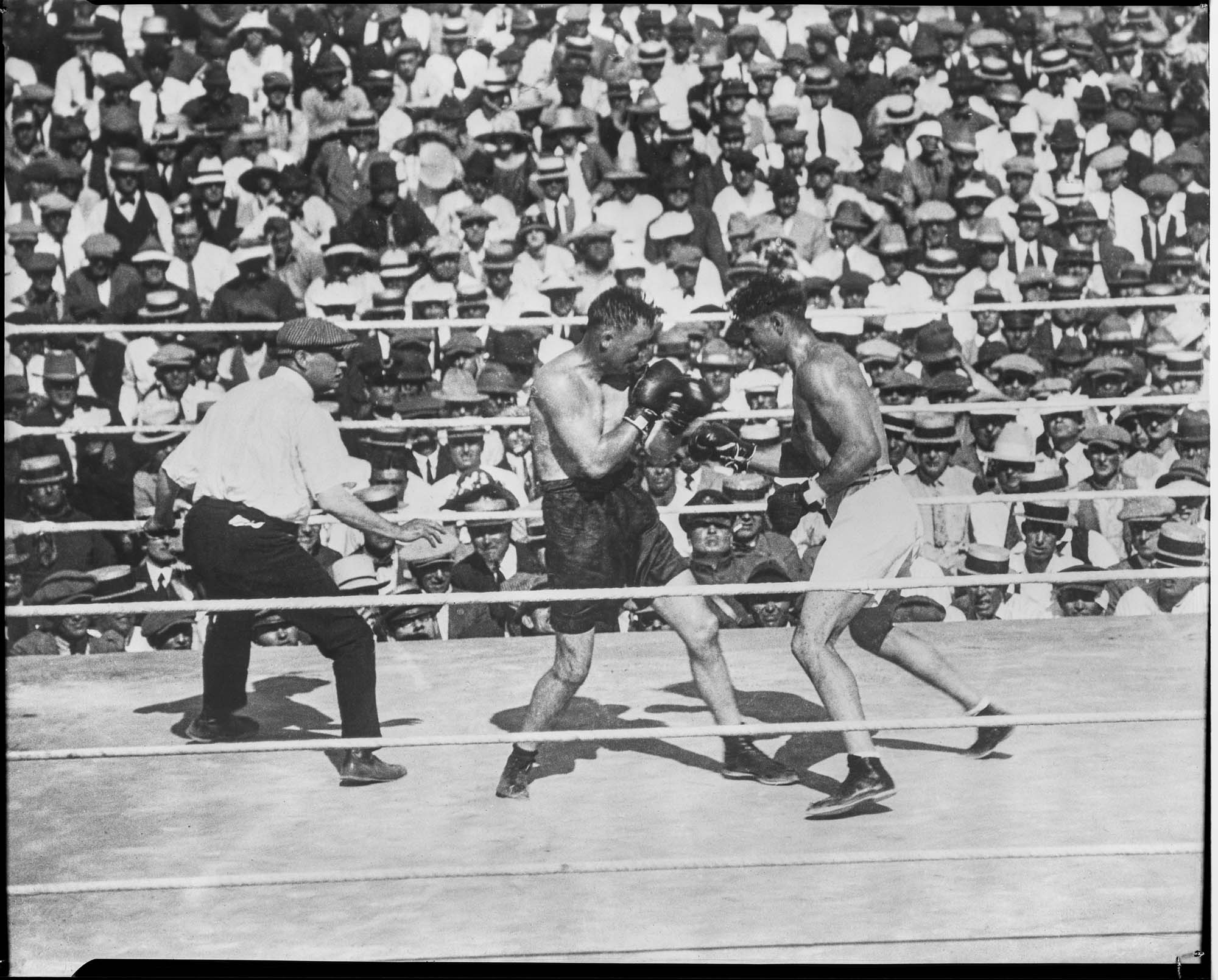 Image of Jack Dempsey and Tommy Gibbons in boxing match, Shelby, Montana, July 4, 1923