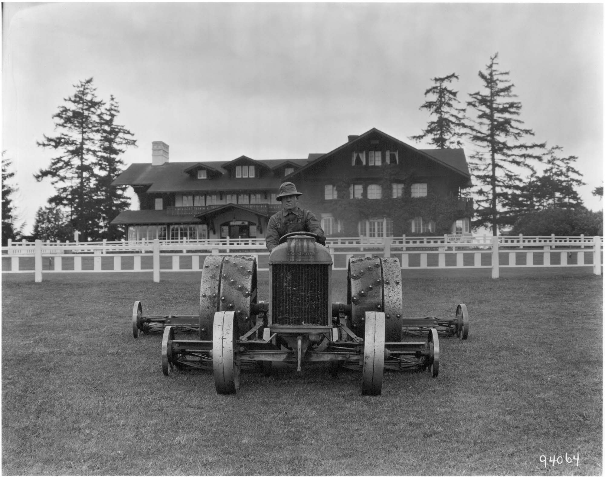 Image of Man mowing lawn at Seattle Golf Club,  The Highlands, circa 1922