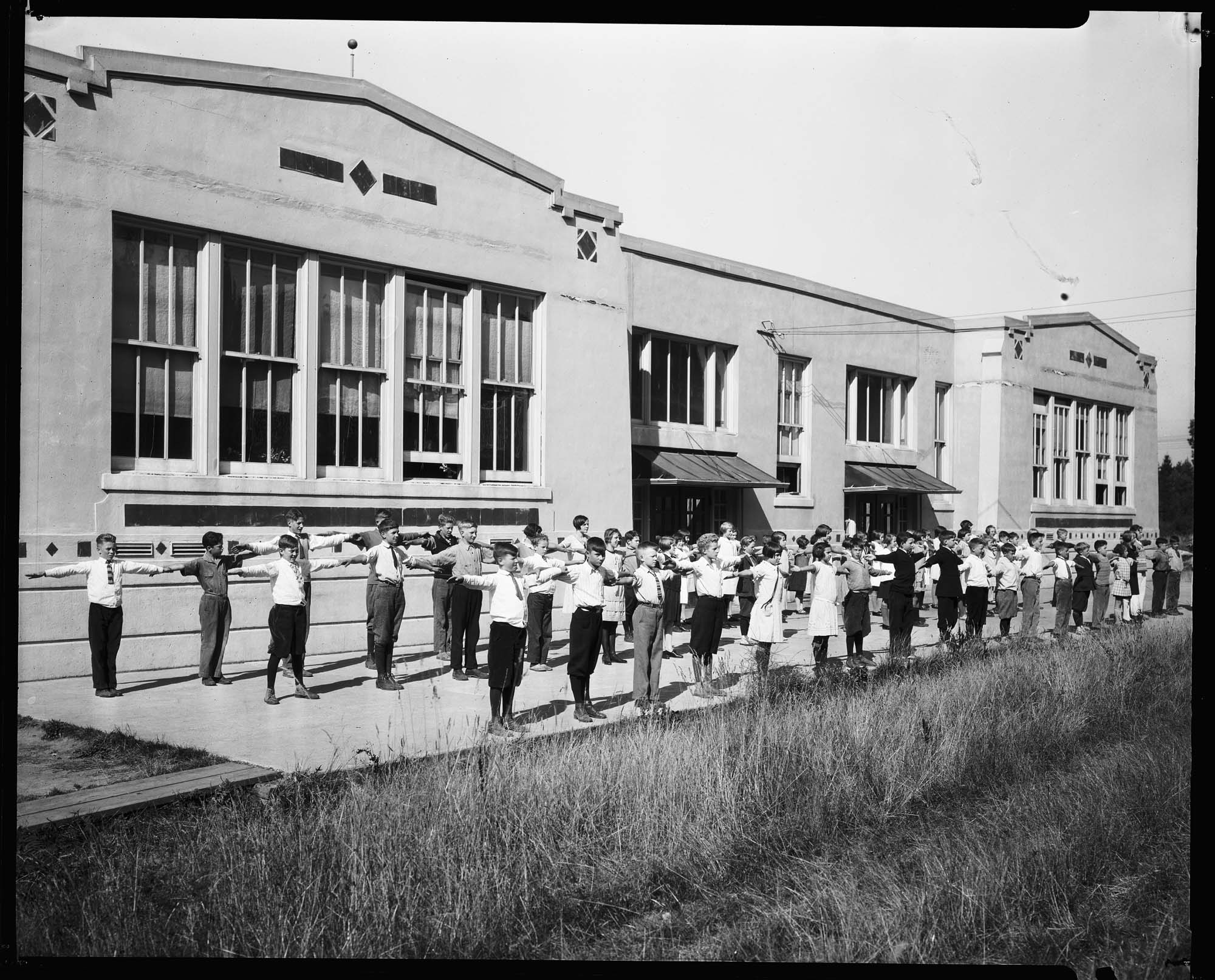Image of Children doing exercises at East Seattle School, circa 1925