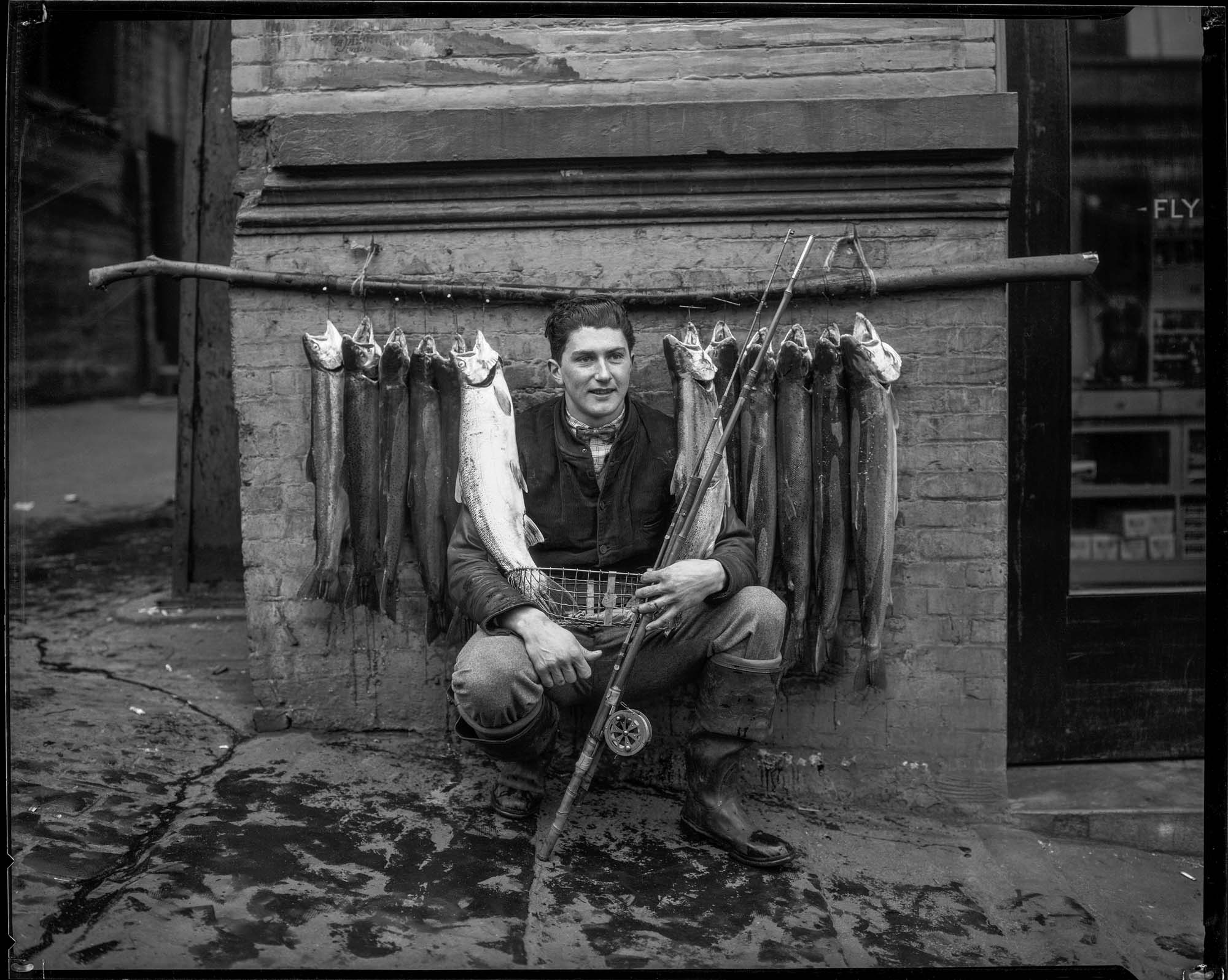 Image of Eddie Bauer with steelhead trout, 1926