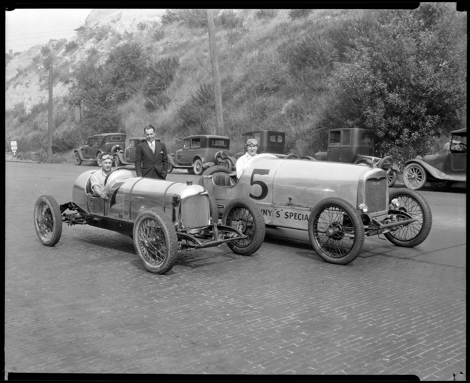 Image of Ken Schoenfeld and Mario Bianchi with racing cars, circa 1928