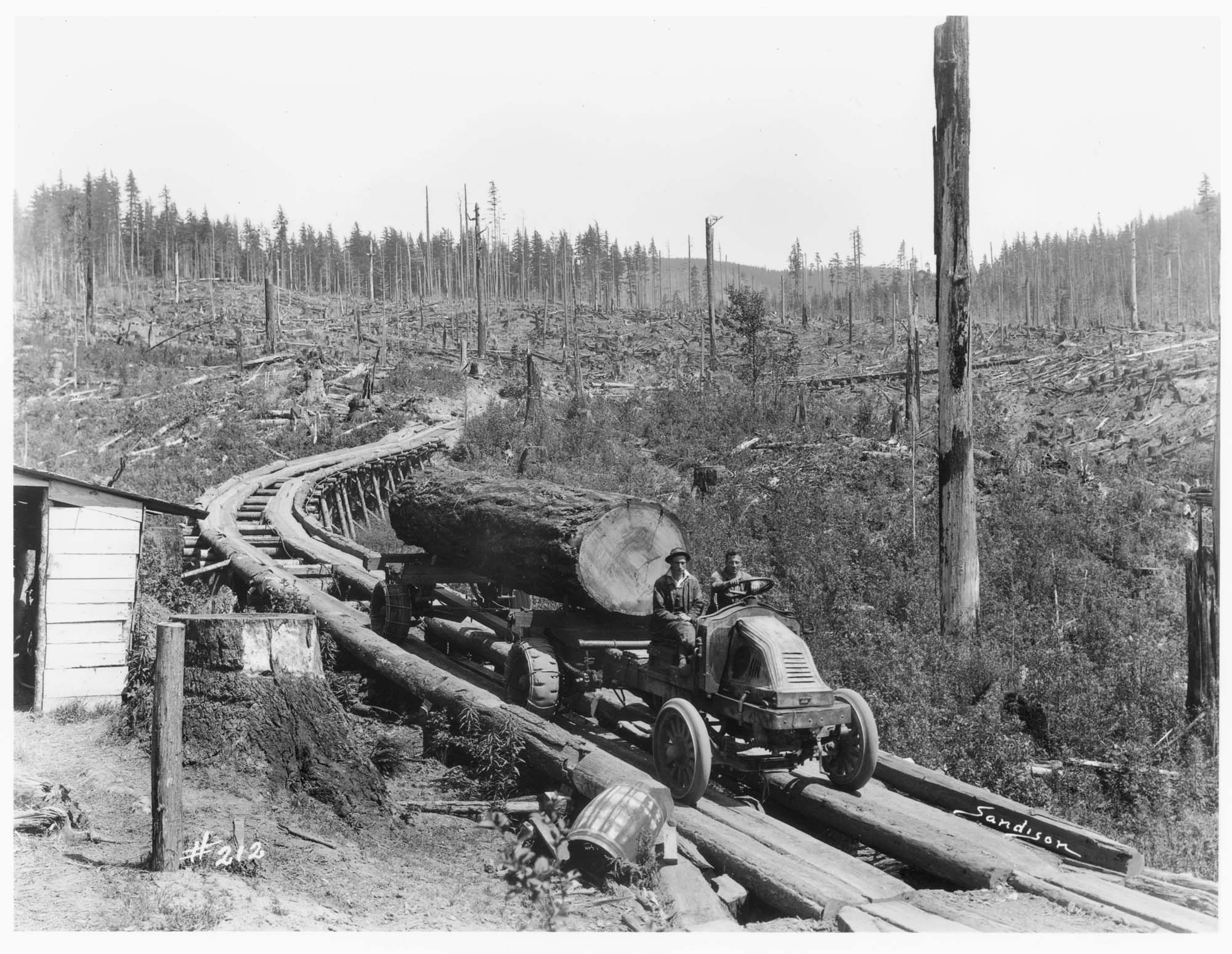 Image of Kelly-Springfield truck hauling logs, circa 1925