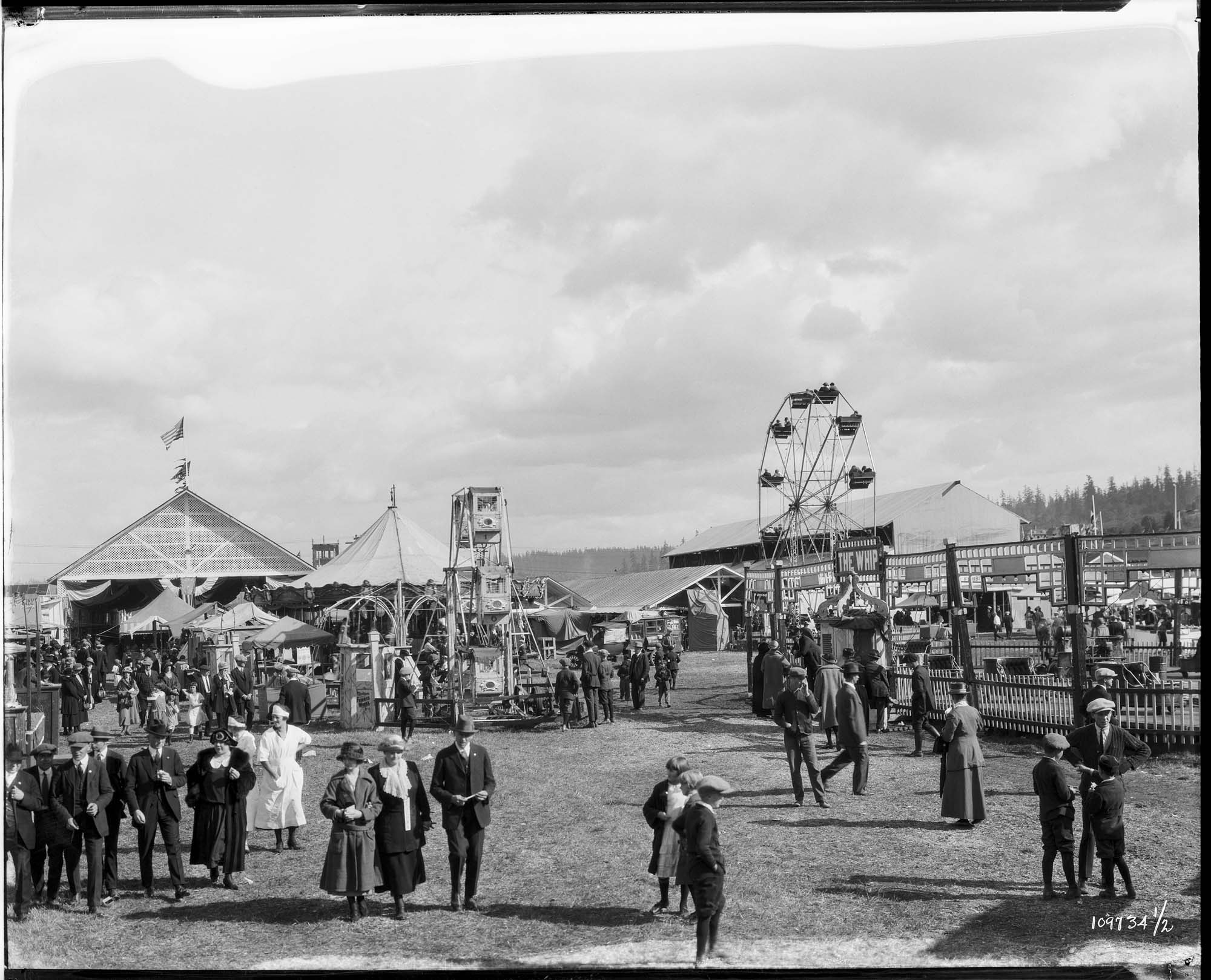 Image of Ferris wheels and crowds at the Western Washington Fair, Puyallup , circa 1924