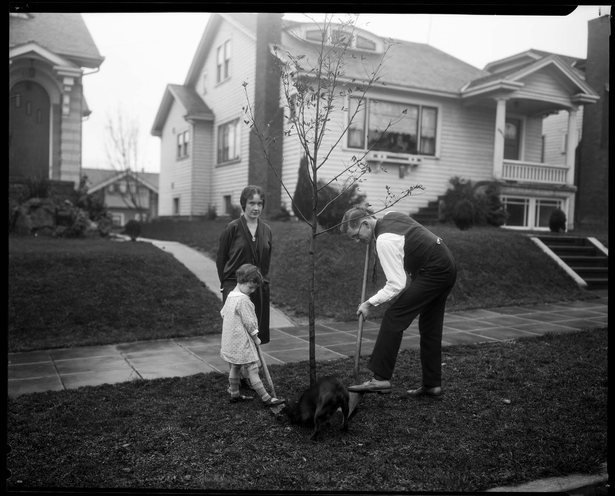 Image of Family planting a tree, circa 1927