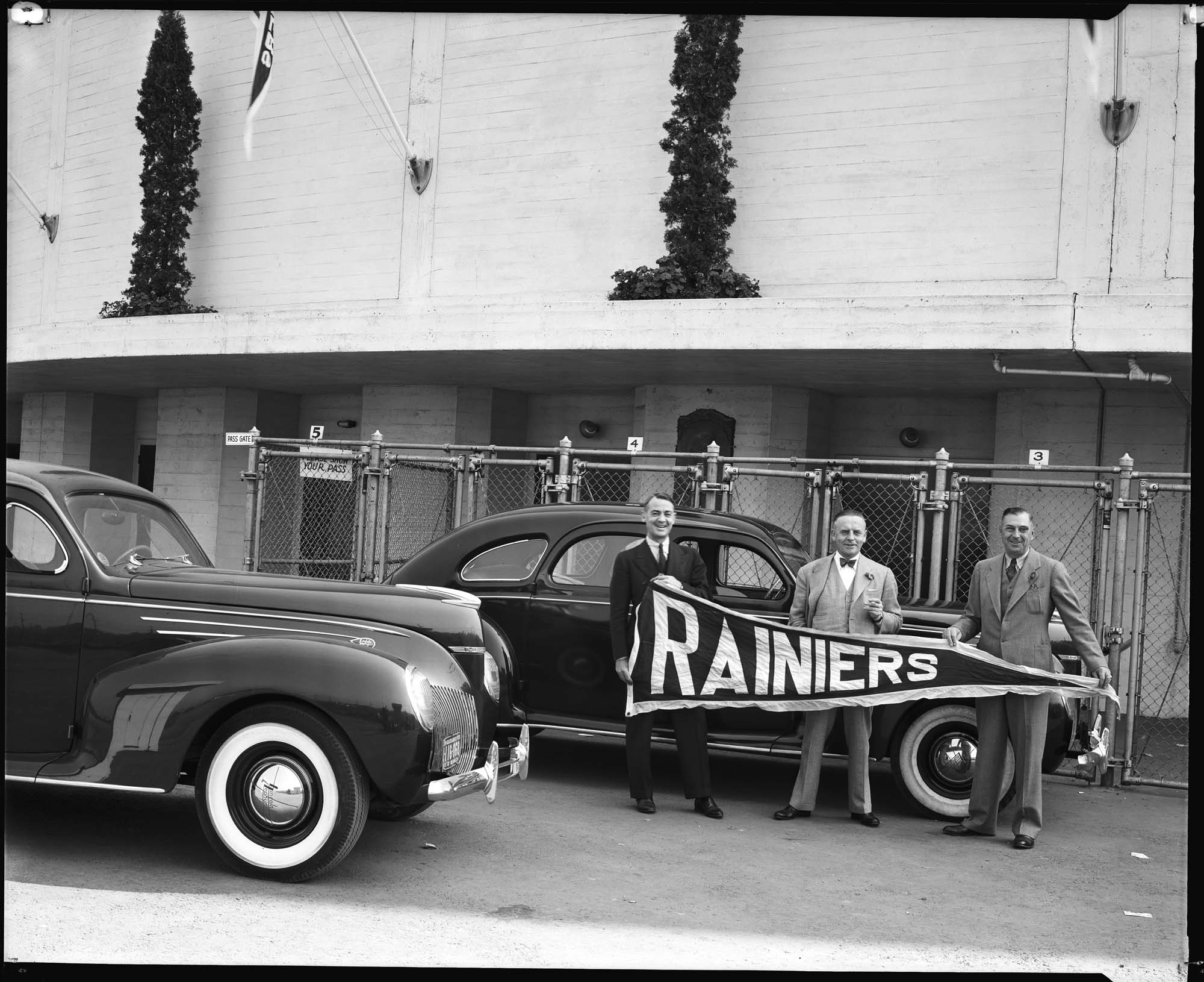 Image of Men with Rainiers pennant outside Sick's Stadium, Seattle, circa 1939