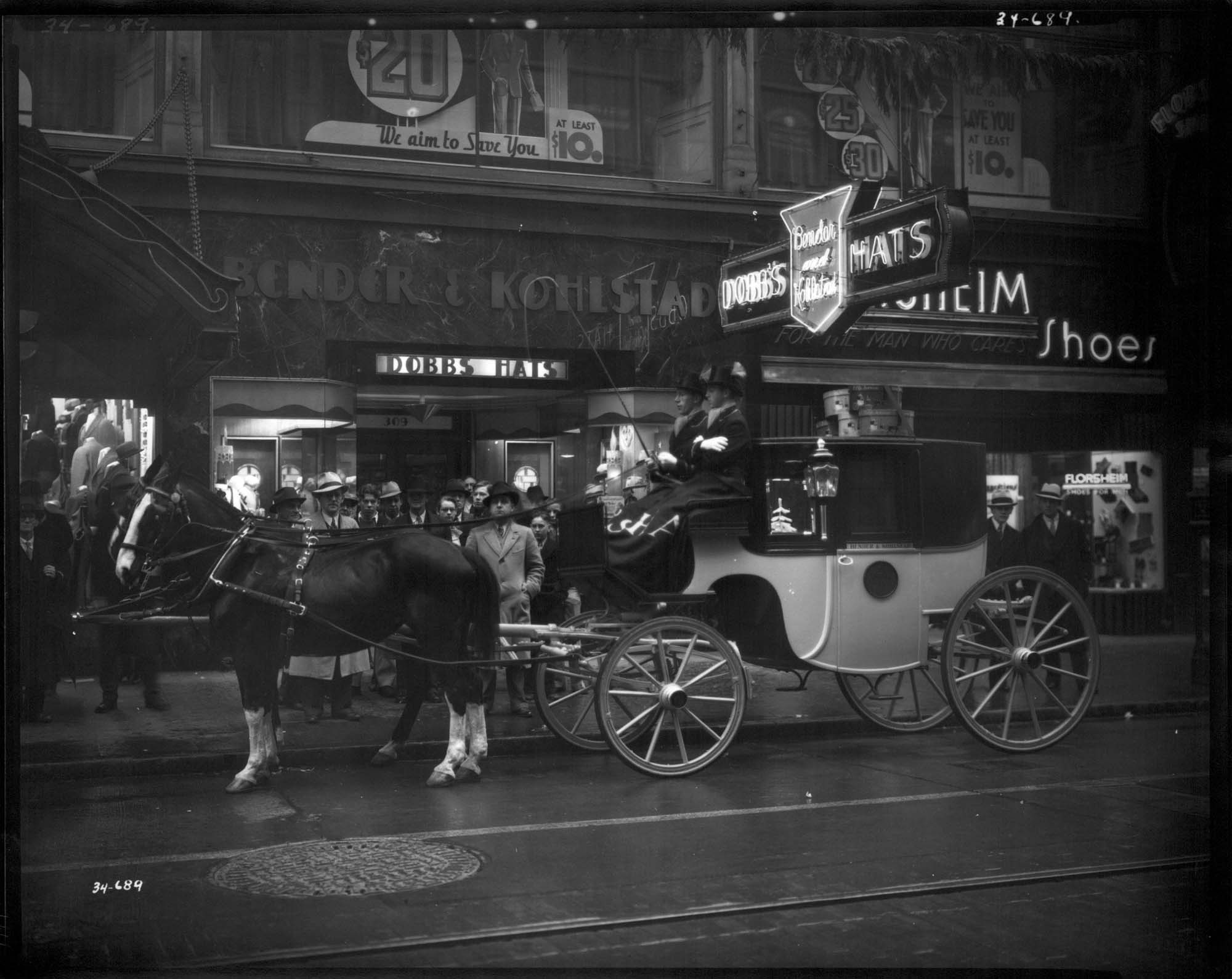 Image of Horse and carriage outside Bender & Kohlstad, Seattle, 1934