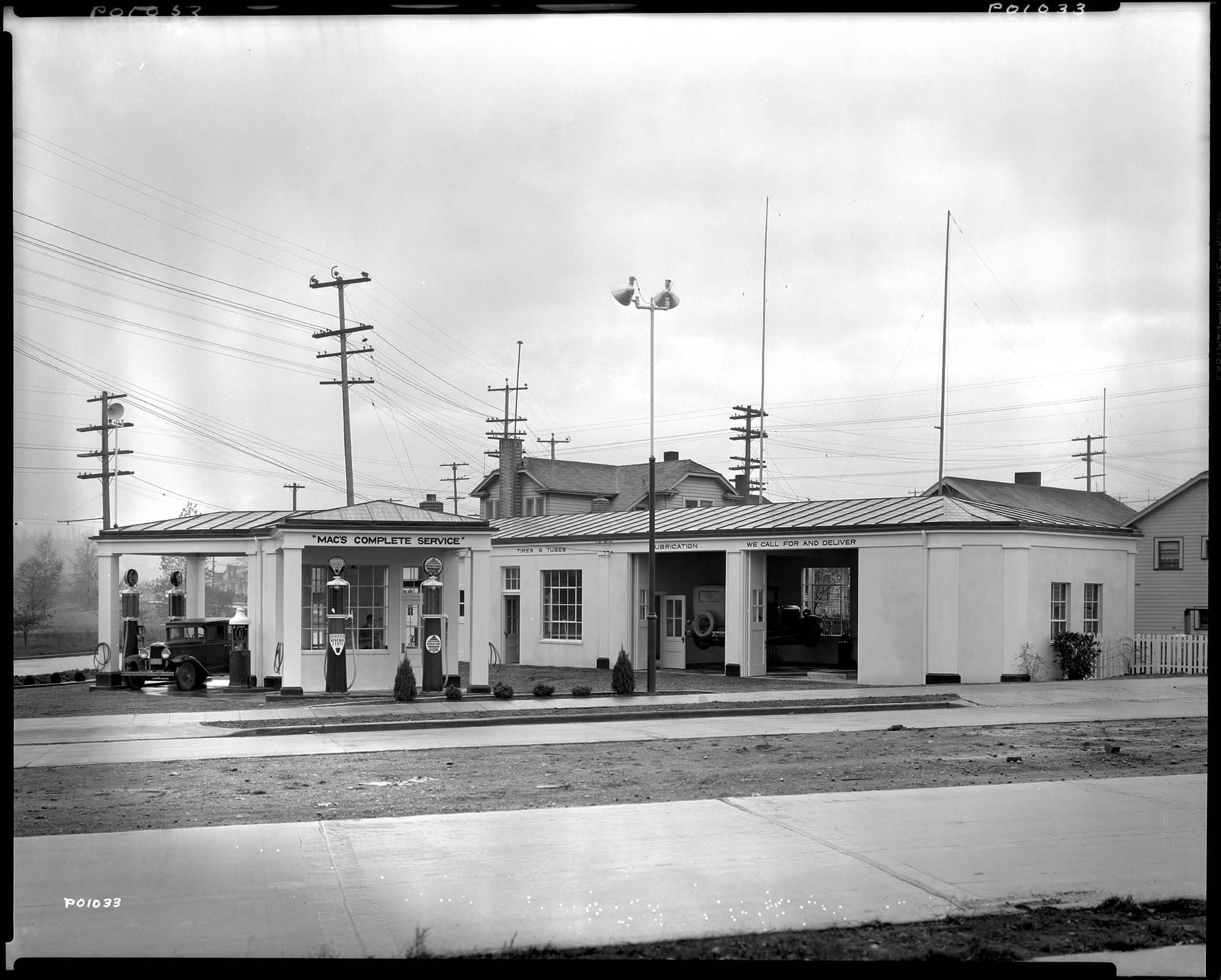 Image of Mac's Complete Service automobile service station, circa 1933