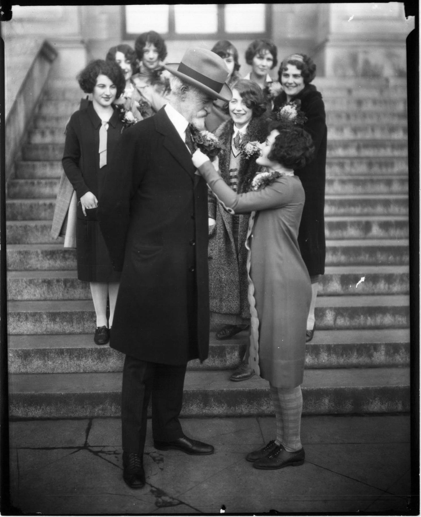 Image of University of Washington student pinning corsage on Edmond Meany, Seattle, circa 1925