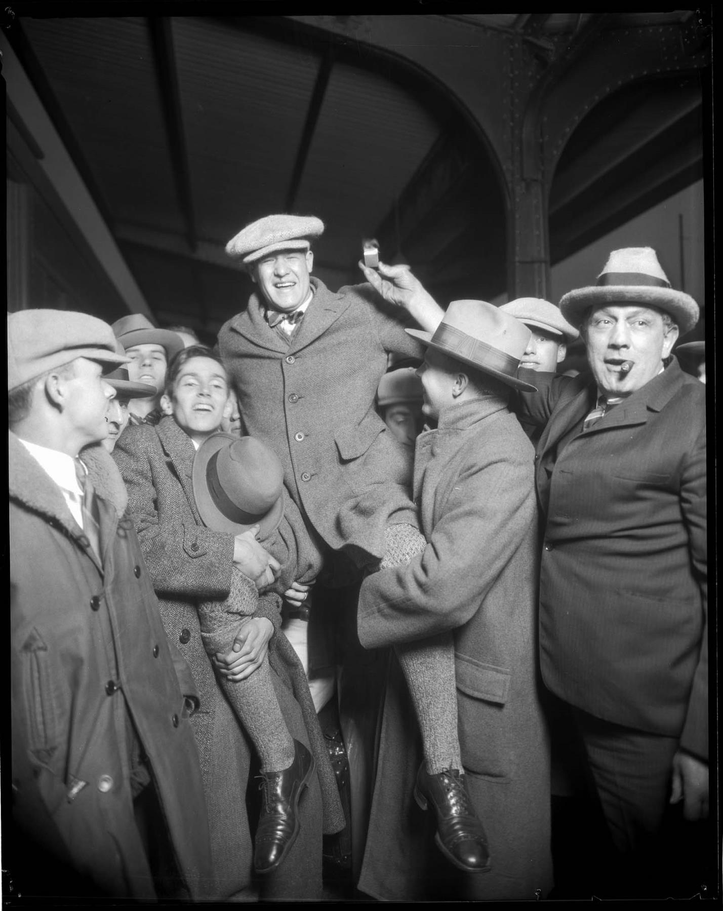 Image of Captain of a victorious football team being welcomed back to Seattle, November 16, 1925