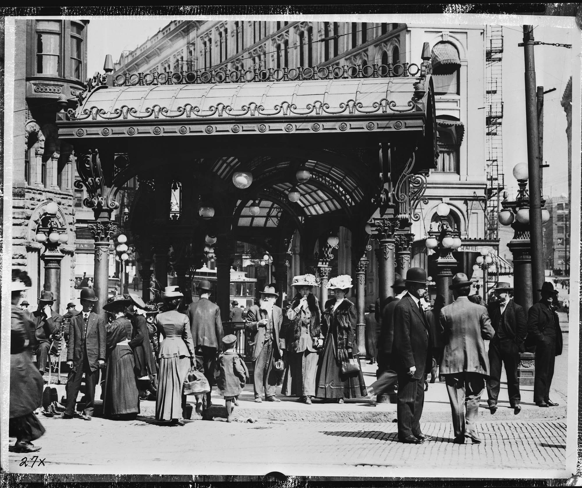 Image of People under Pioneer Square pergola, Seattle, circa 1910
