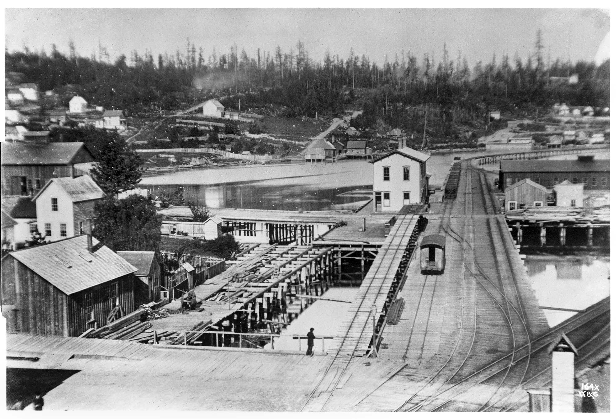 Image of First railroad depot in Seattle, circa 1880