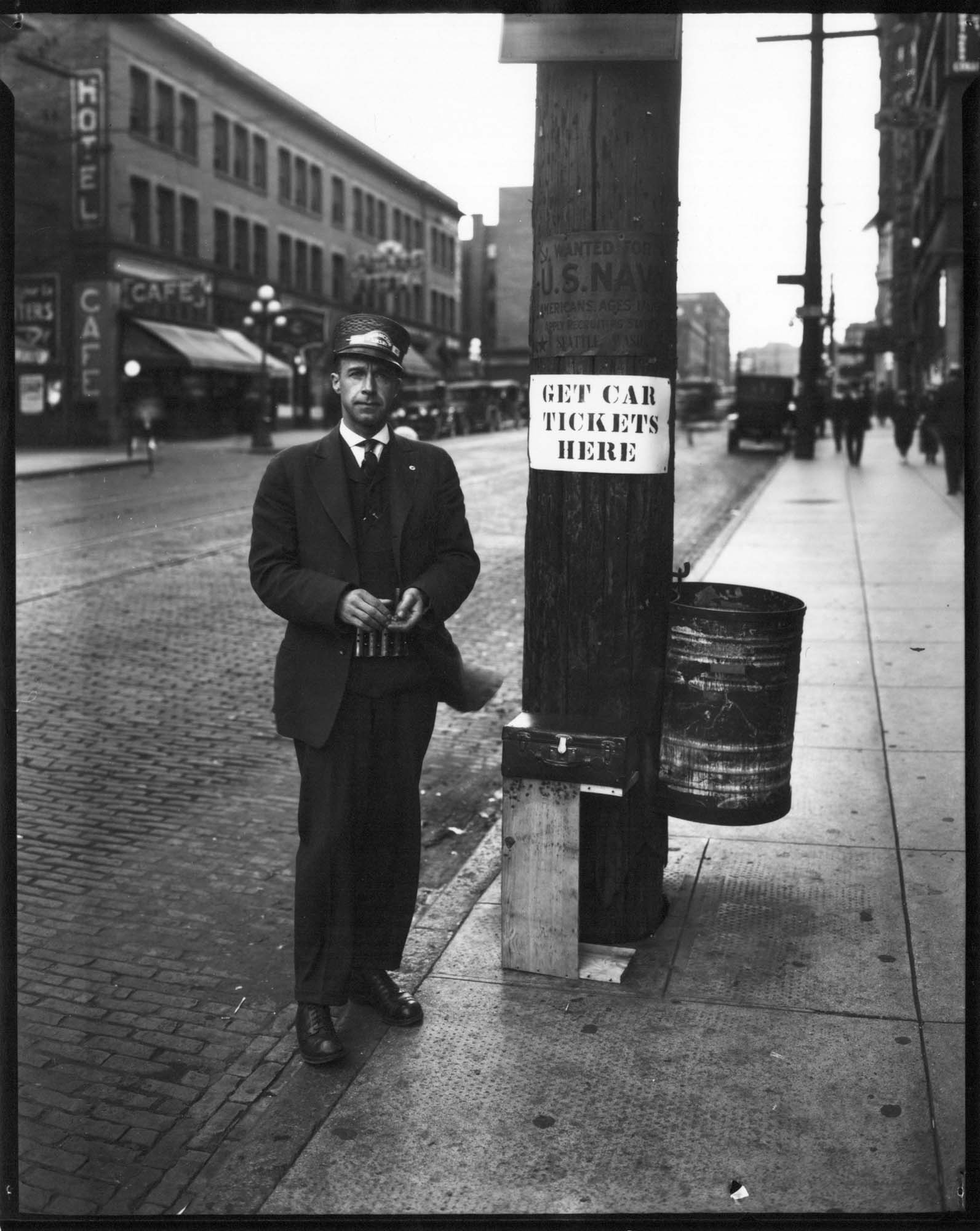 Image of Streetcar employee selling tokens, Seattle, circa 1925