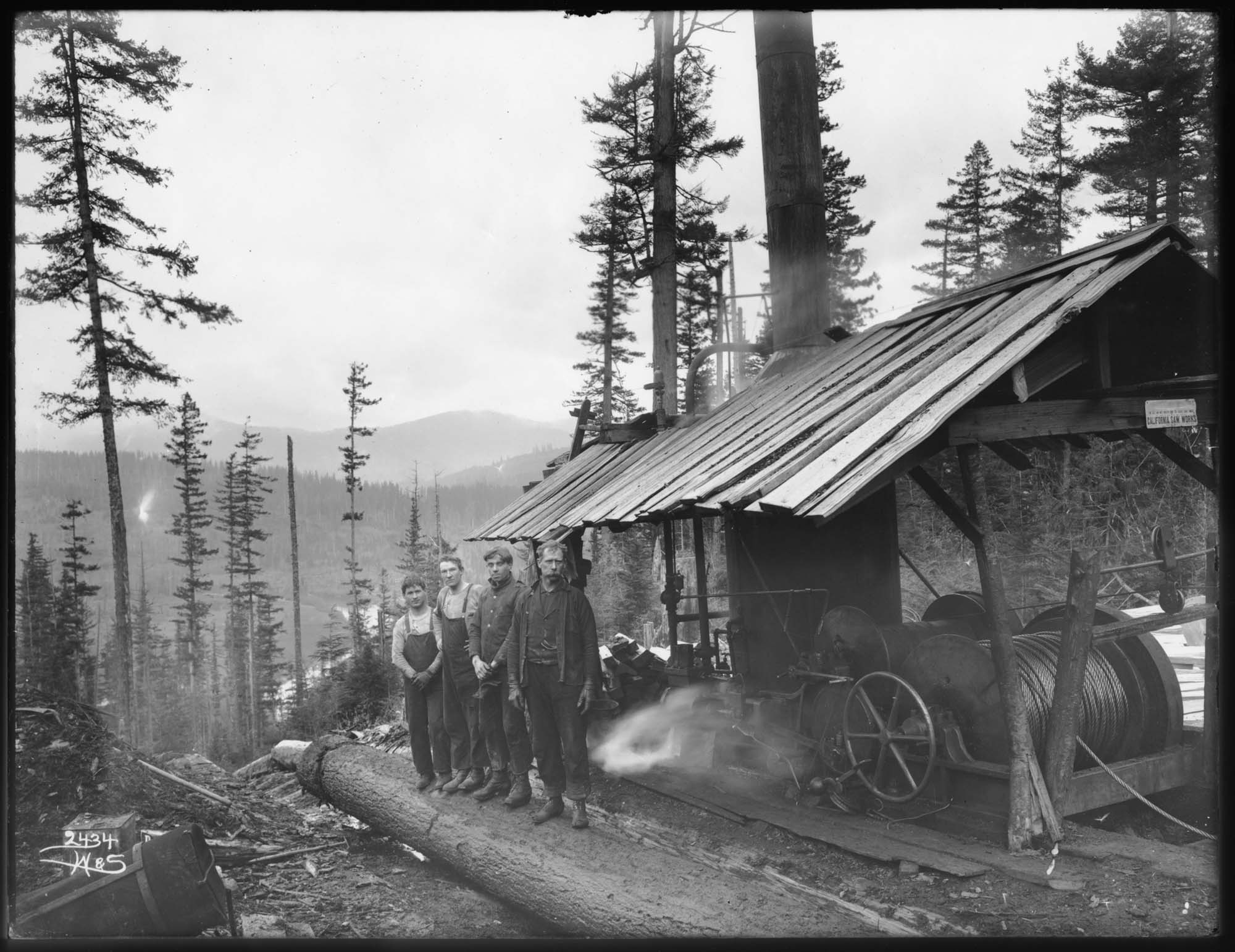 Image of Loggers at top of log chute, circa 1902