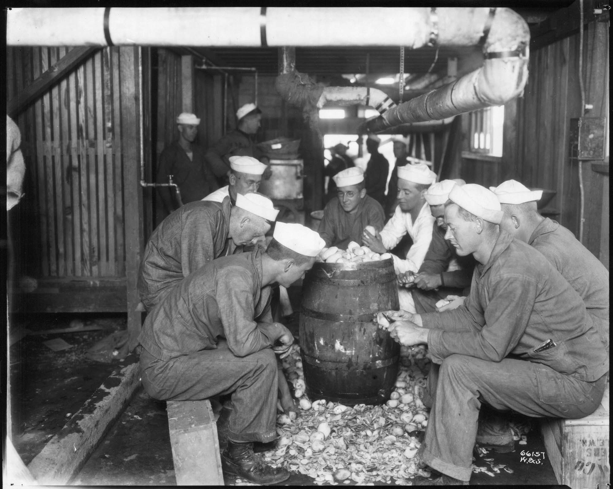 Image of Sailors peeling potatoes at naval training camp, Seattle, circa 1918