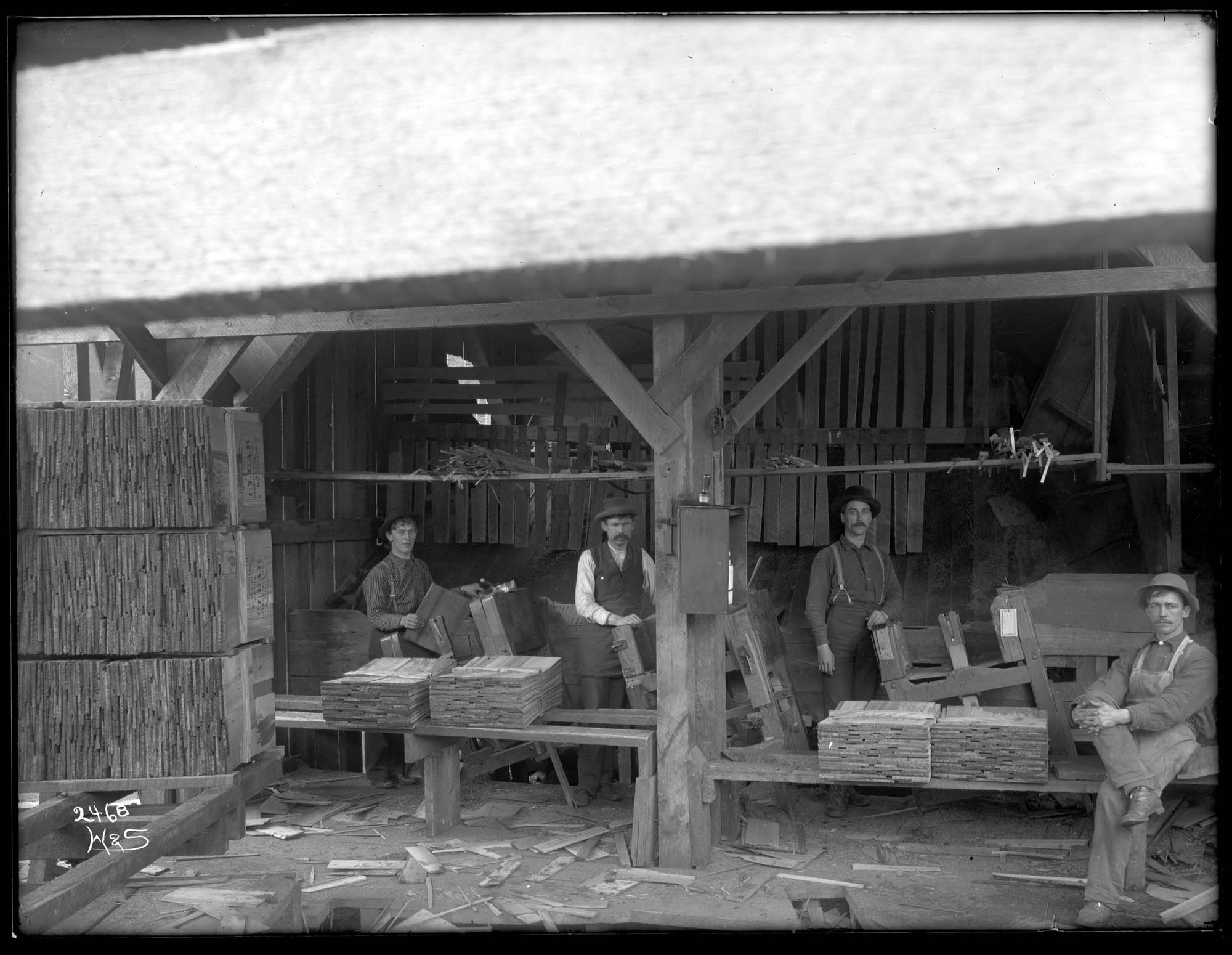 Image of Workmen packing shingles at the Holcom-Hartley mill, circa 1905