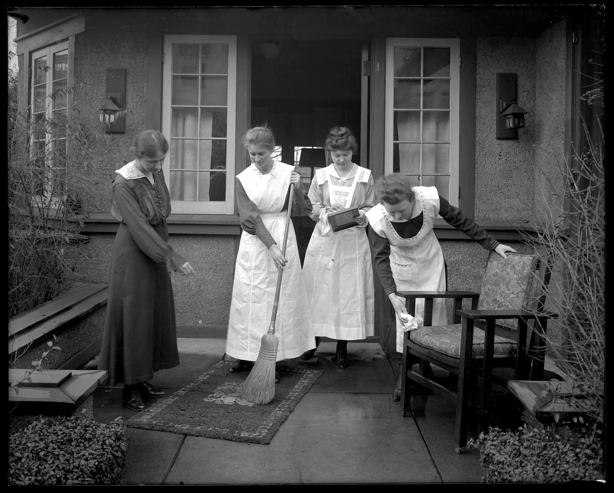 Image of Learning how to dust and sweep, circa 1918