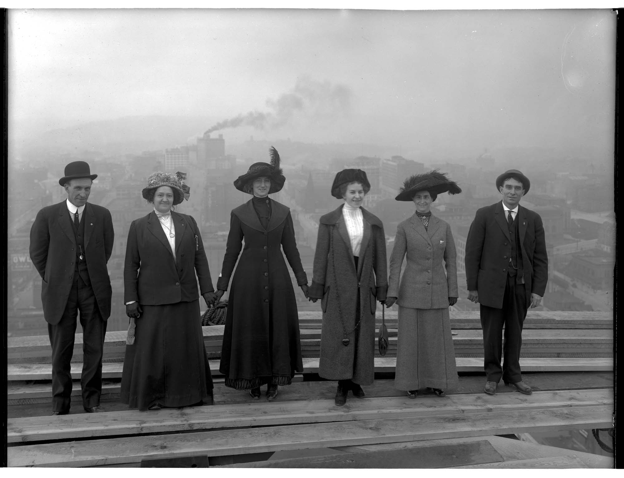 Image of Group of people on the unfinished Smith Tower, circa 1914