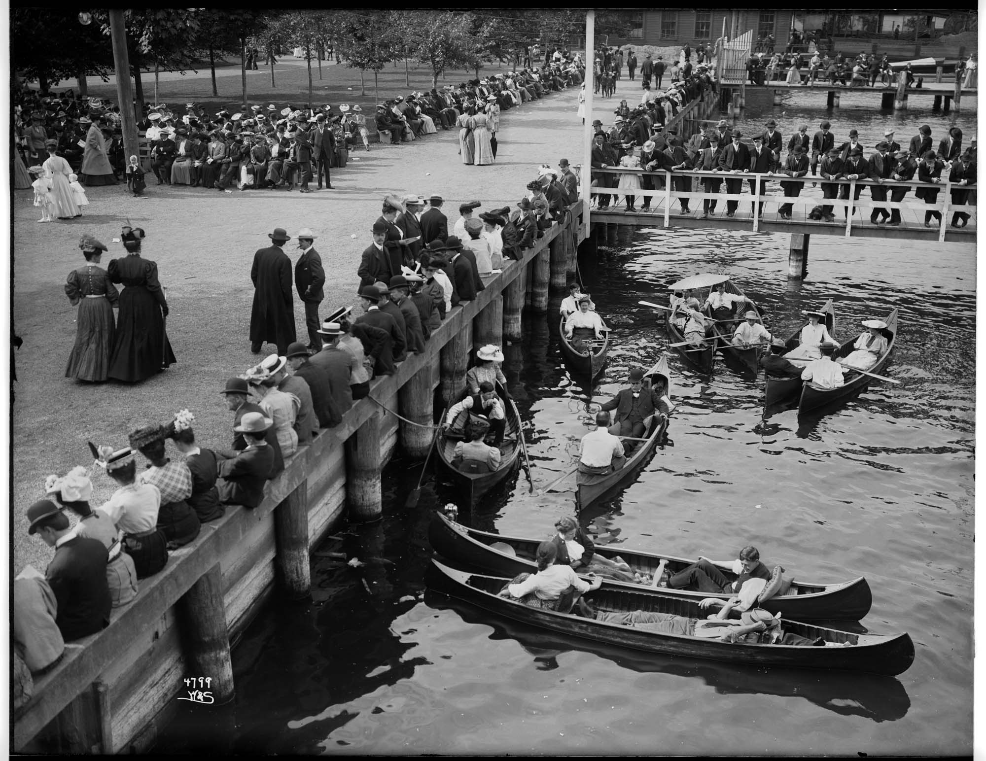 Image of Crowds and canoes at the waterfront in Leschi Park, circa 1911
