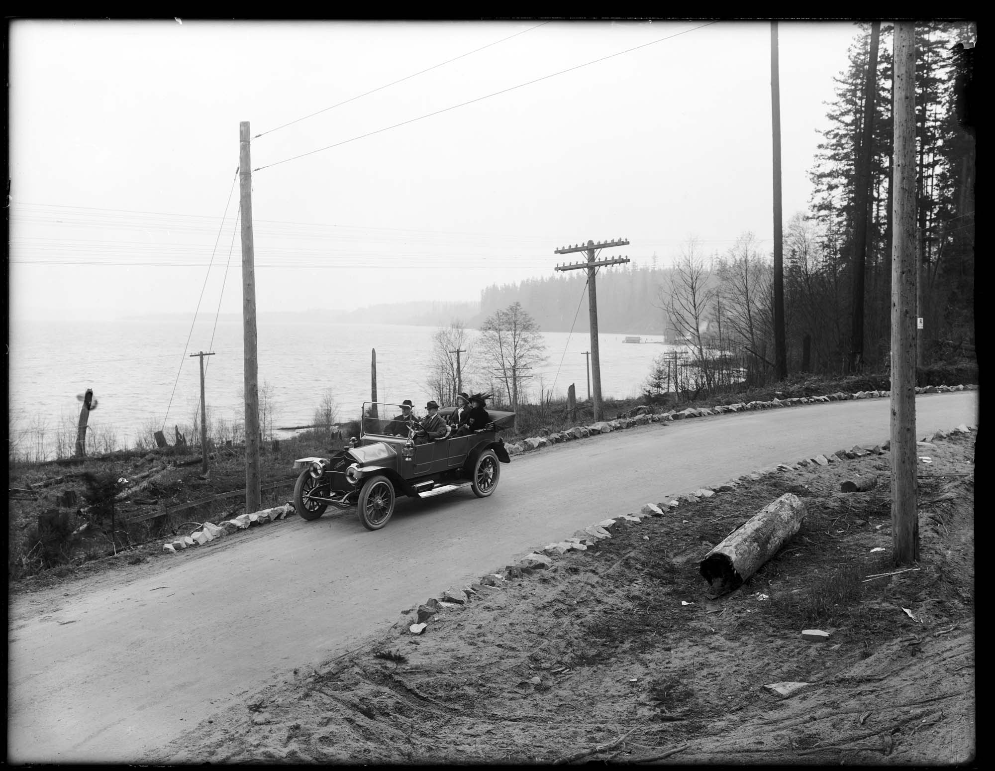 Image of Automobile excursion on the paved Bothell Highway, circa 1911
