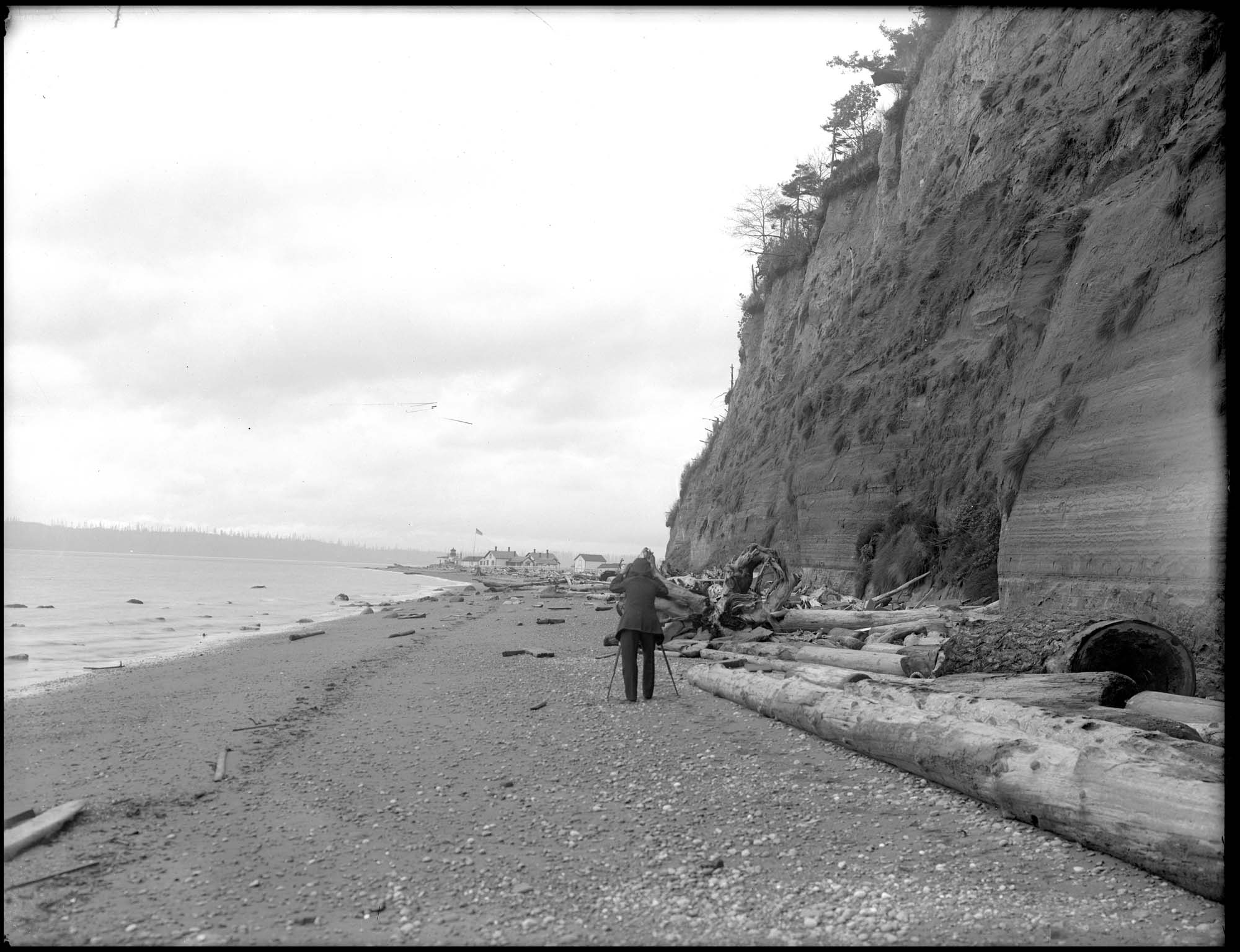 Image of Photographer on beach near West Point Lighthouse, circa 1913