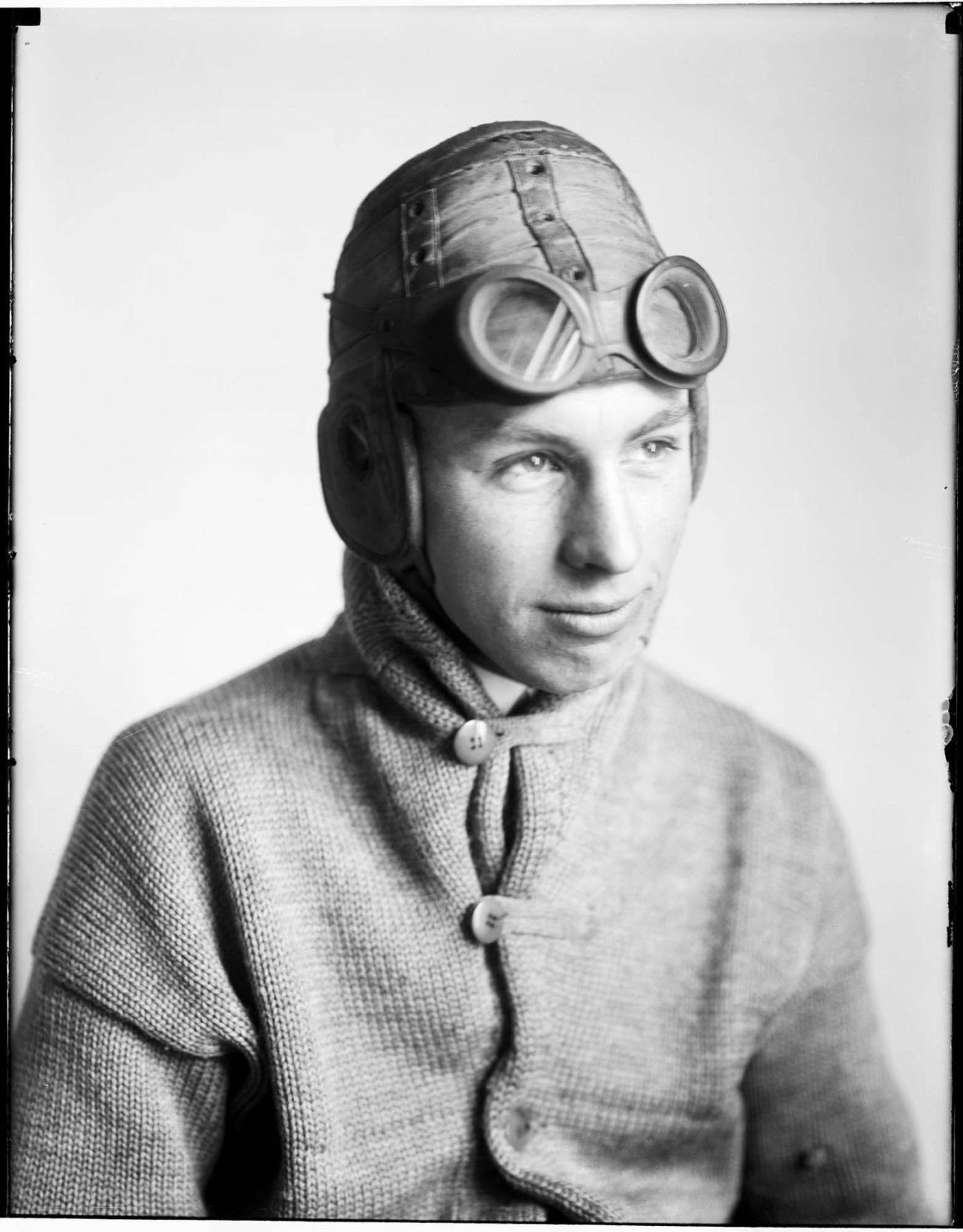 Image of Motorcyclist in helmet, probably in Seattle, circa 1913