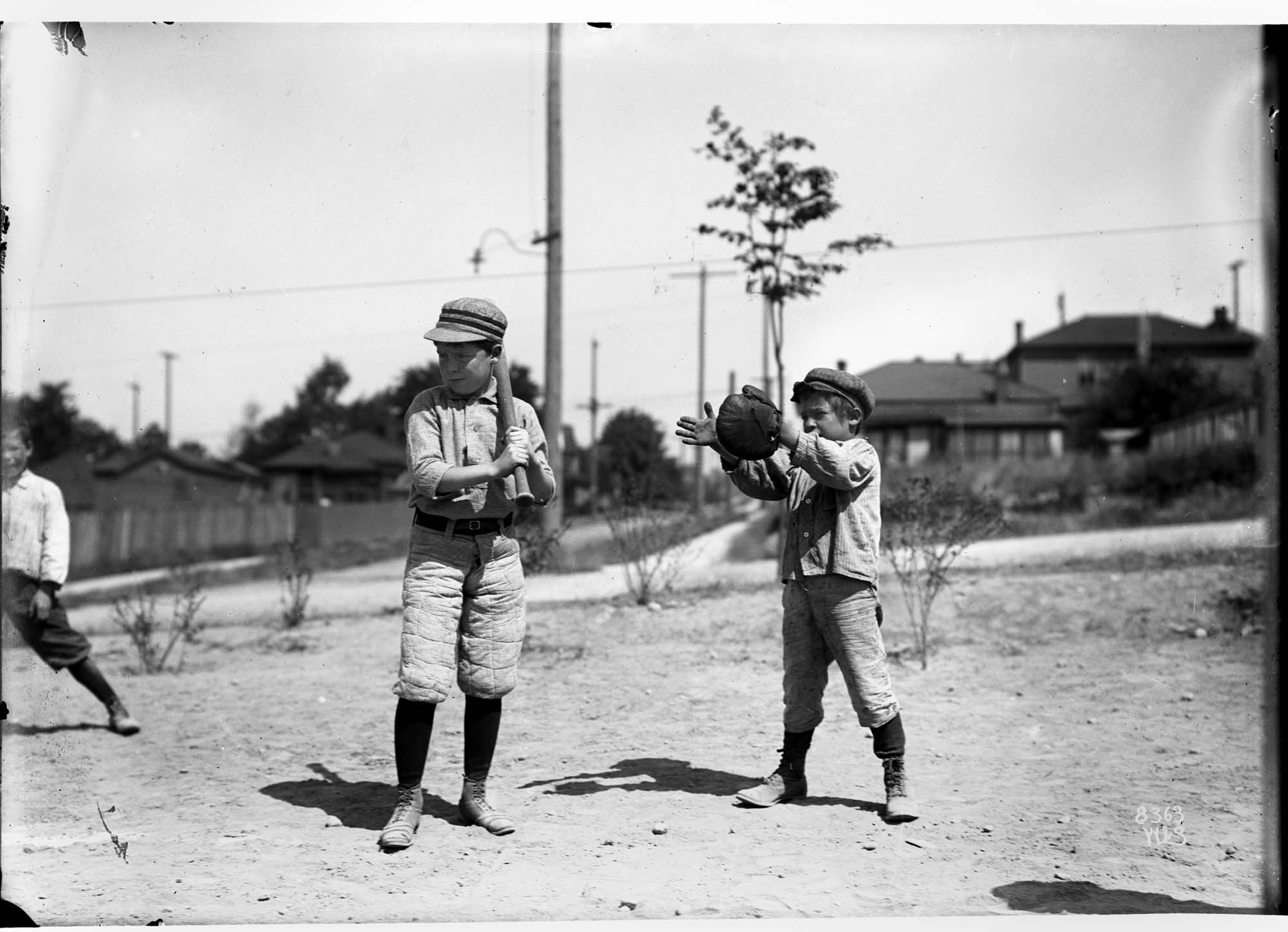 Image of Boys playing baseball, circa 1910