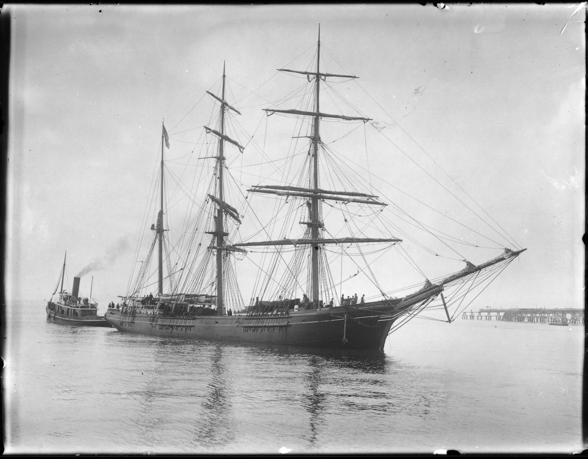 Image of Ship J.D. Peters and tugboat, probably in Seattle, circa 1911