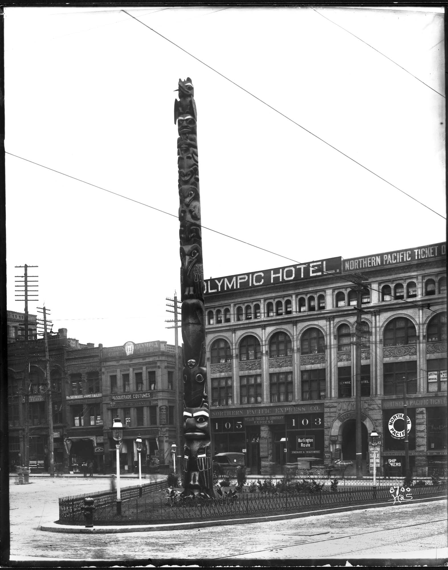 Image of Totem pole in Pioneer Square, Seattle, circa 1905