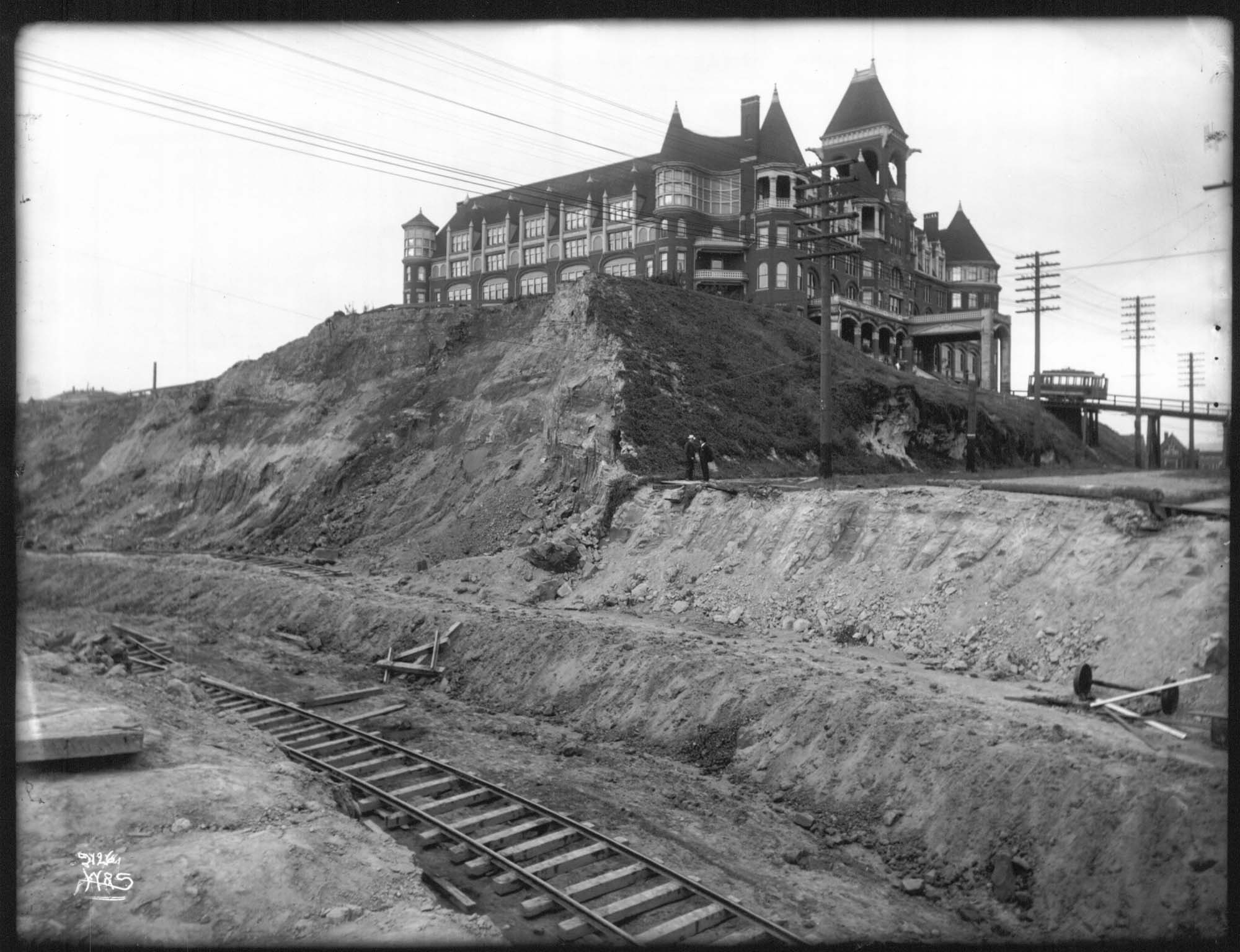 Image of Washington Hotel during regrading of Second Avenue, Seattle, circa 1906