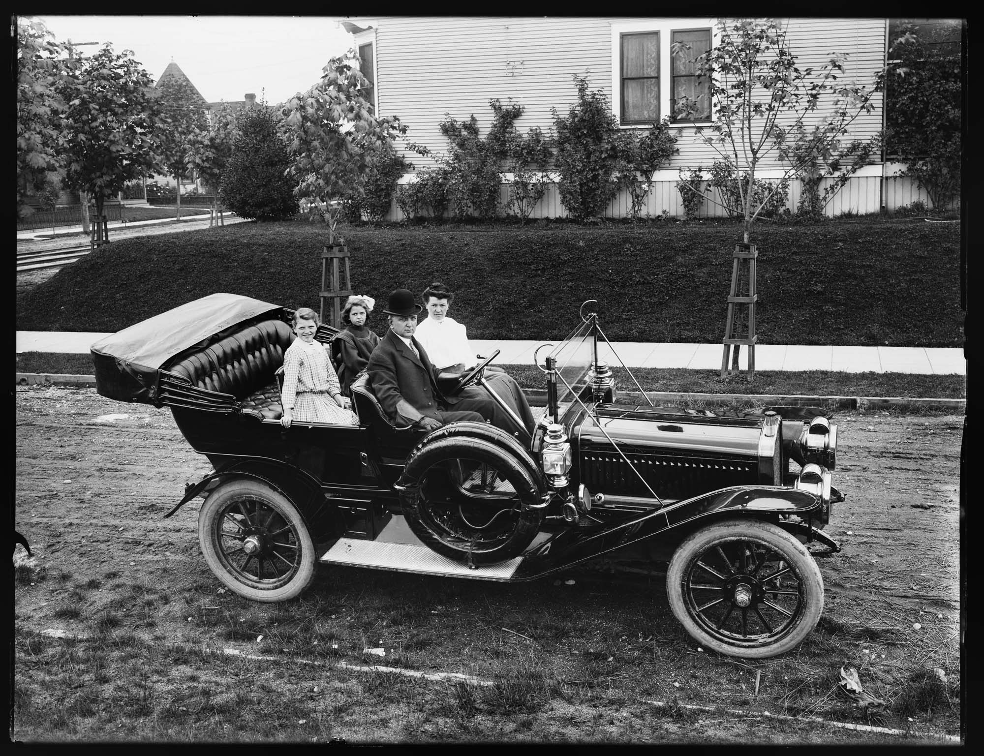 Image of Family in Winton Six automobile, probably in Seattle, 1910