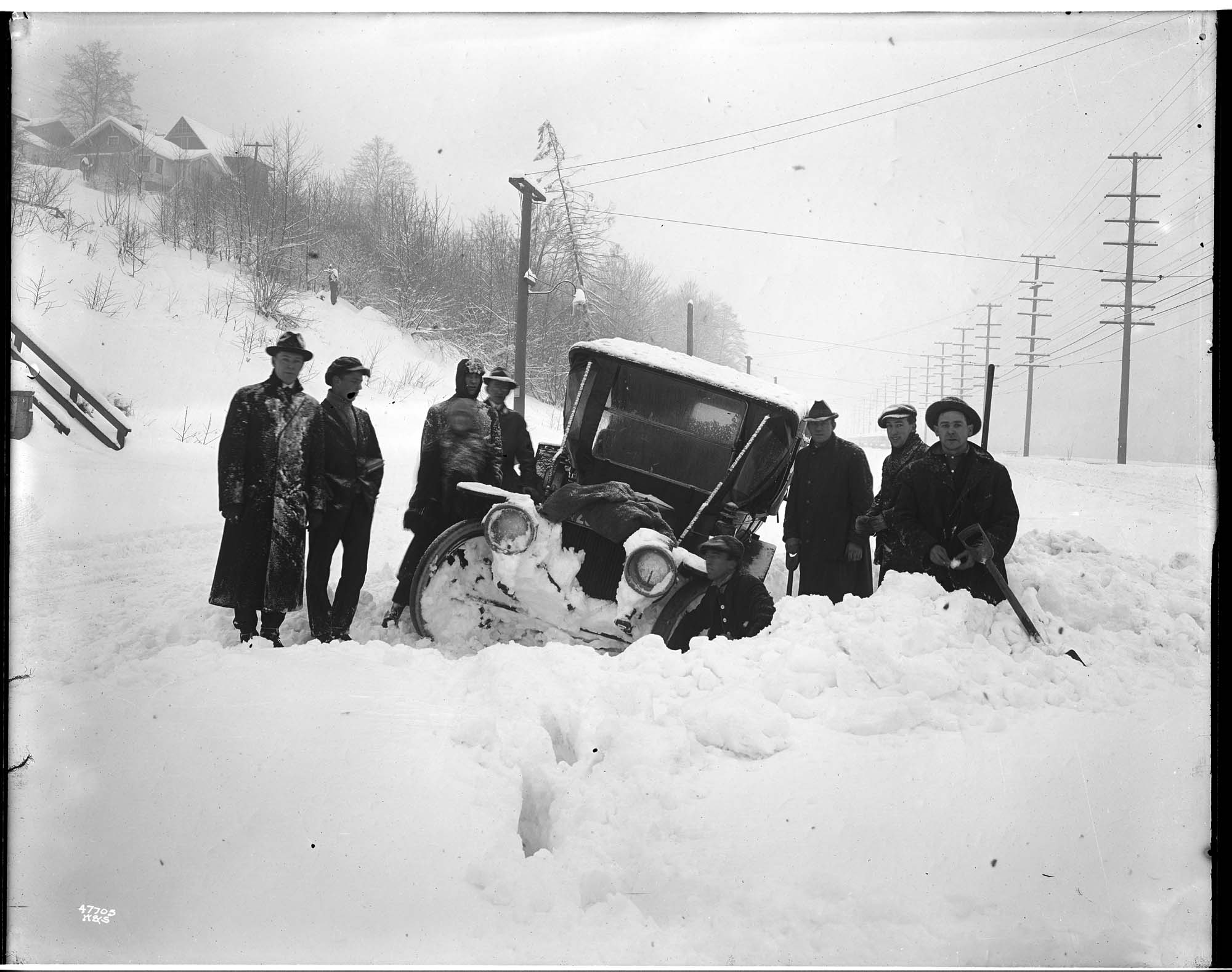 Image of Passengers and jitney bus stalled in the snow, February 2, 1916