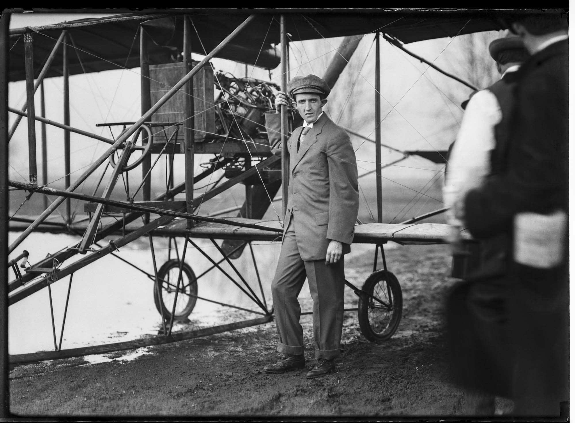 Image of Charles K. Hamilton and his Curtiss biplane, March 1910