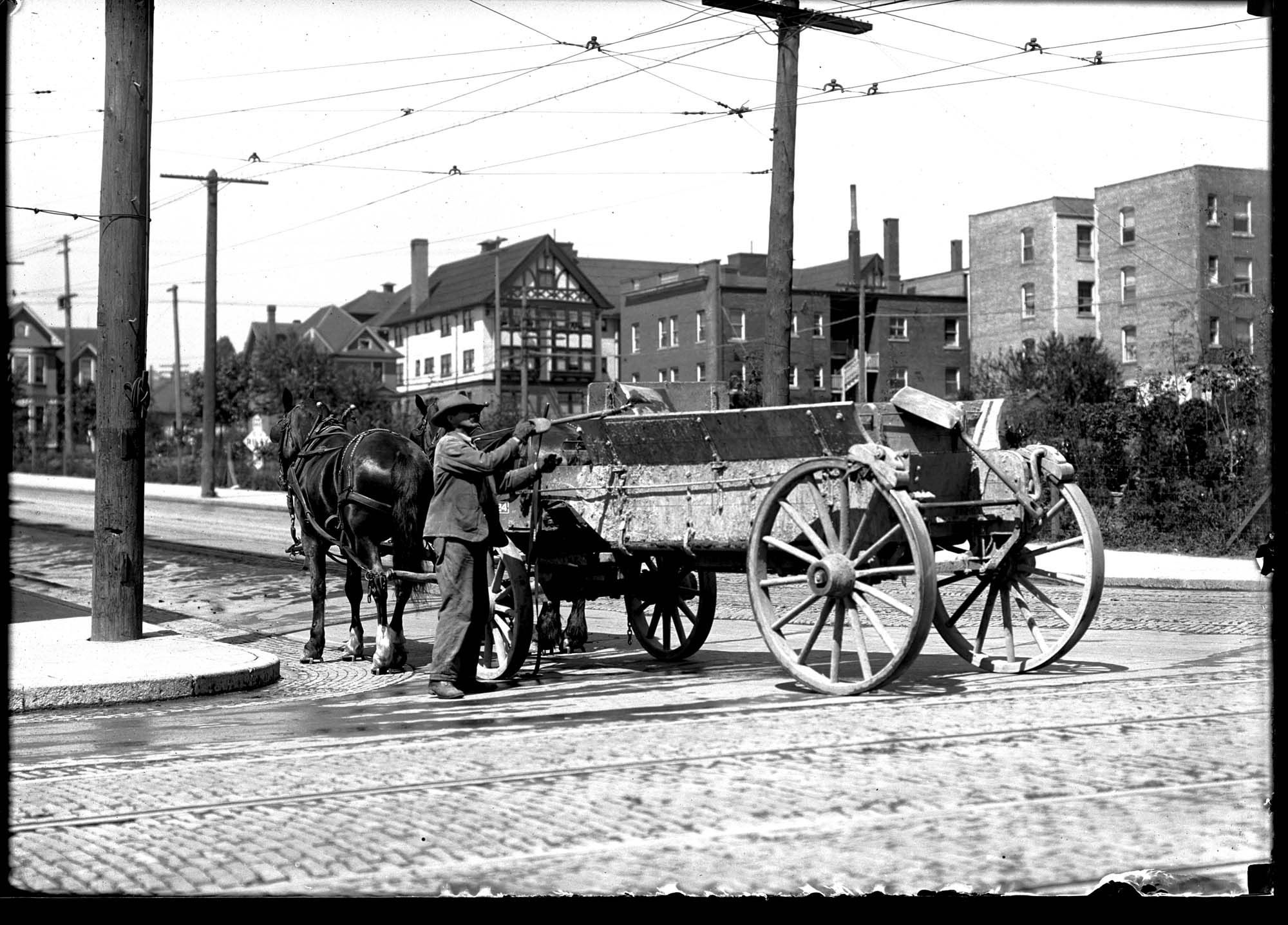 Image of Street sweeper at work, Seattle, circa 1910