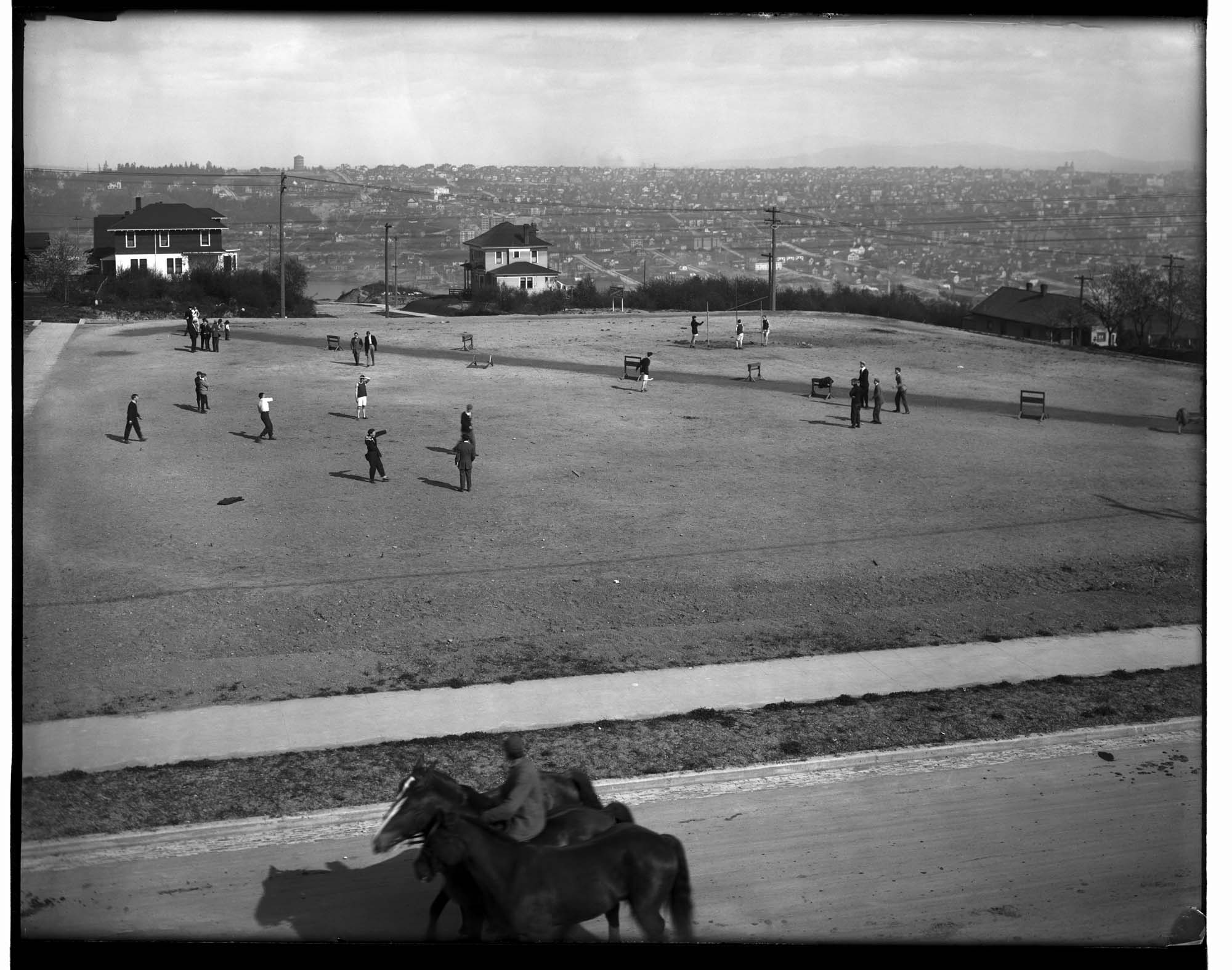 Image of Boys playing baseball on Queen Anne High School playfield, Seattle, circa 1914