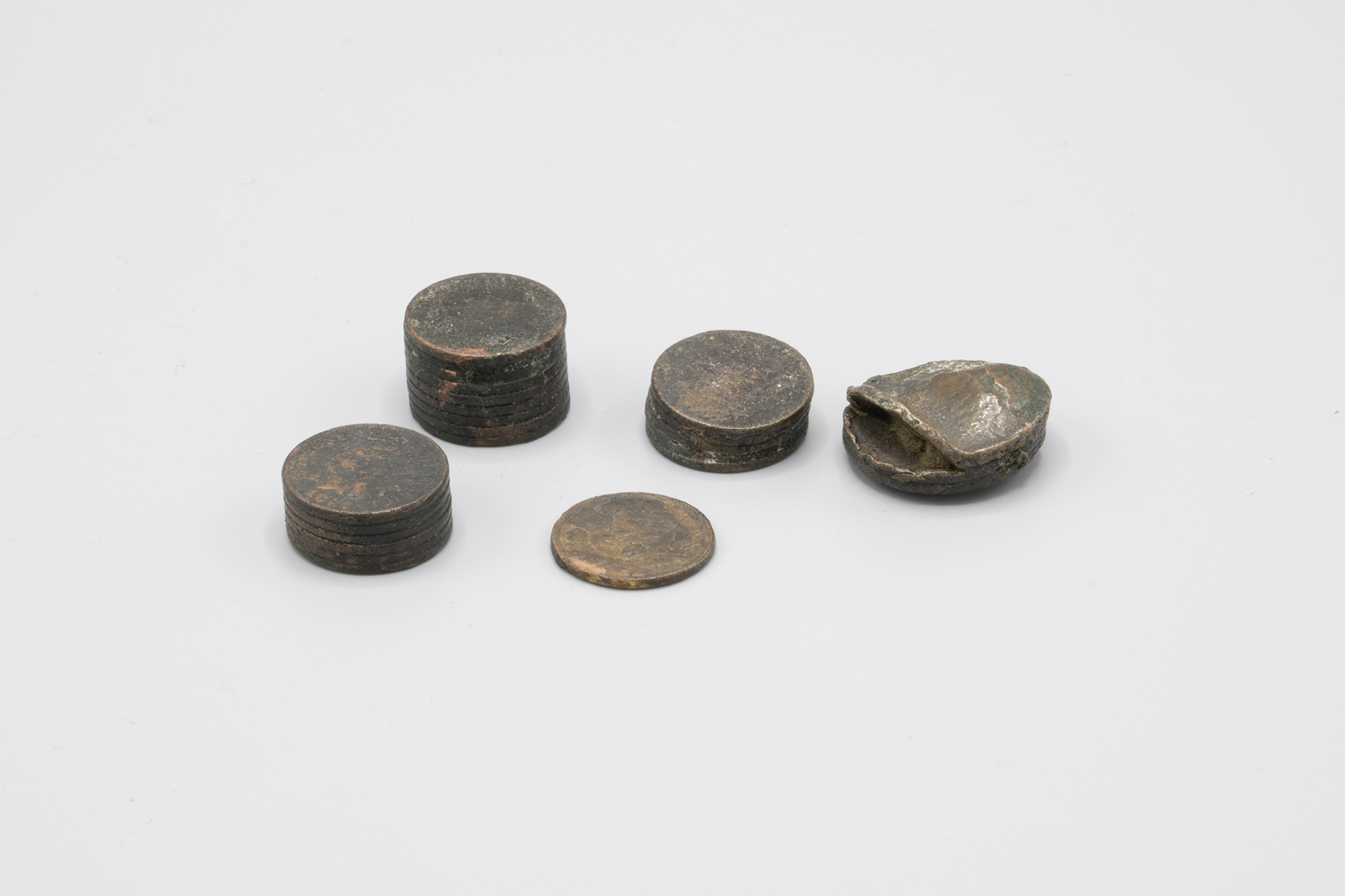 Image of Various coins melted in the Great Seattle Fire of 1889