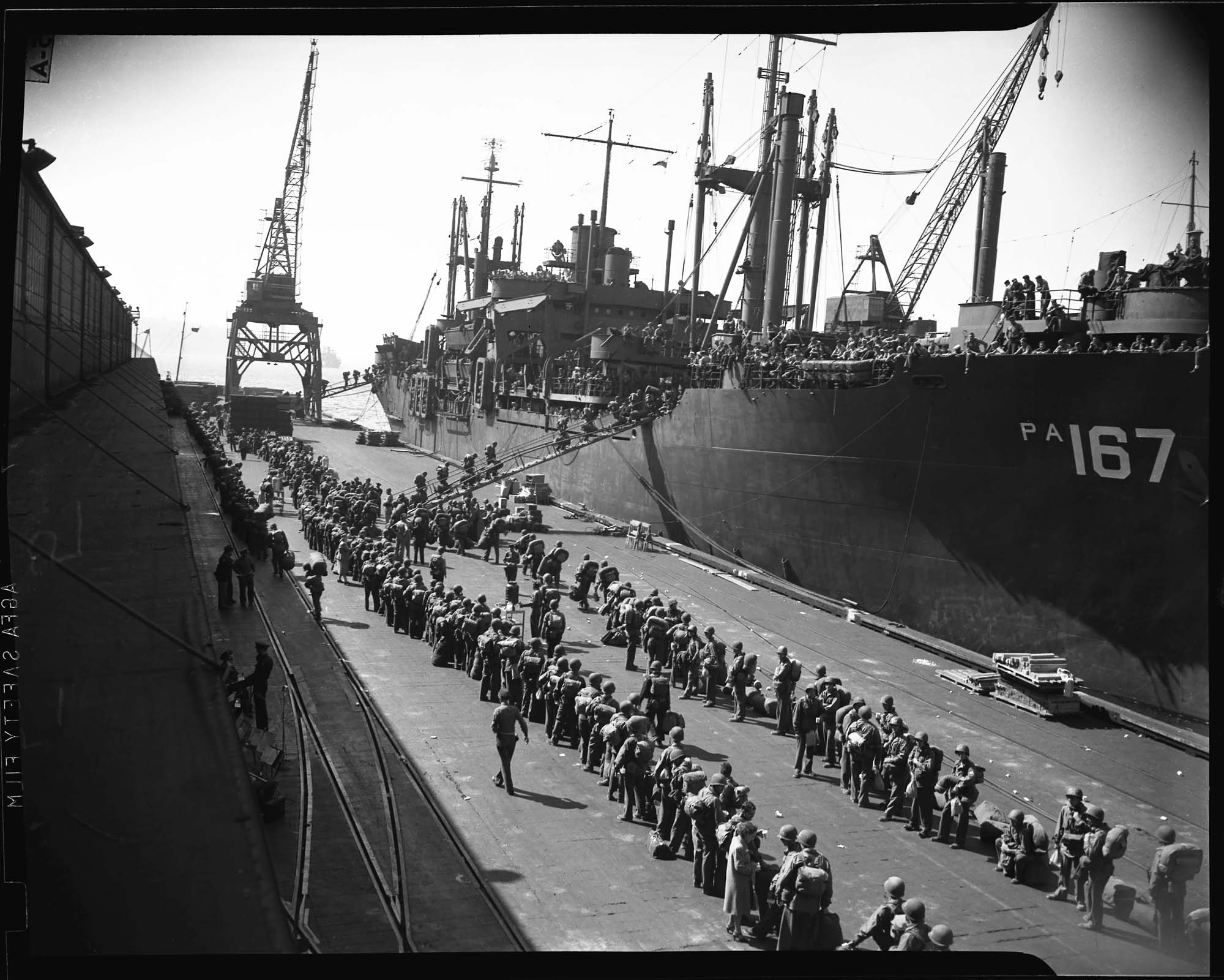 Image of Troops boarding ship at Port of Embarkation, Seattle, 1945
