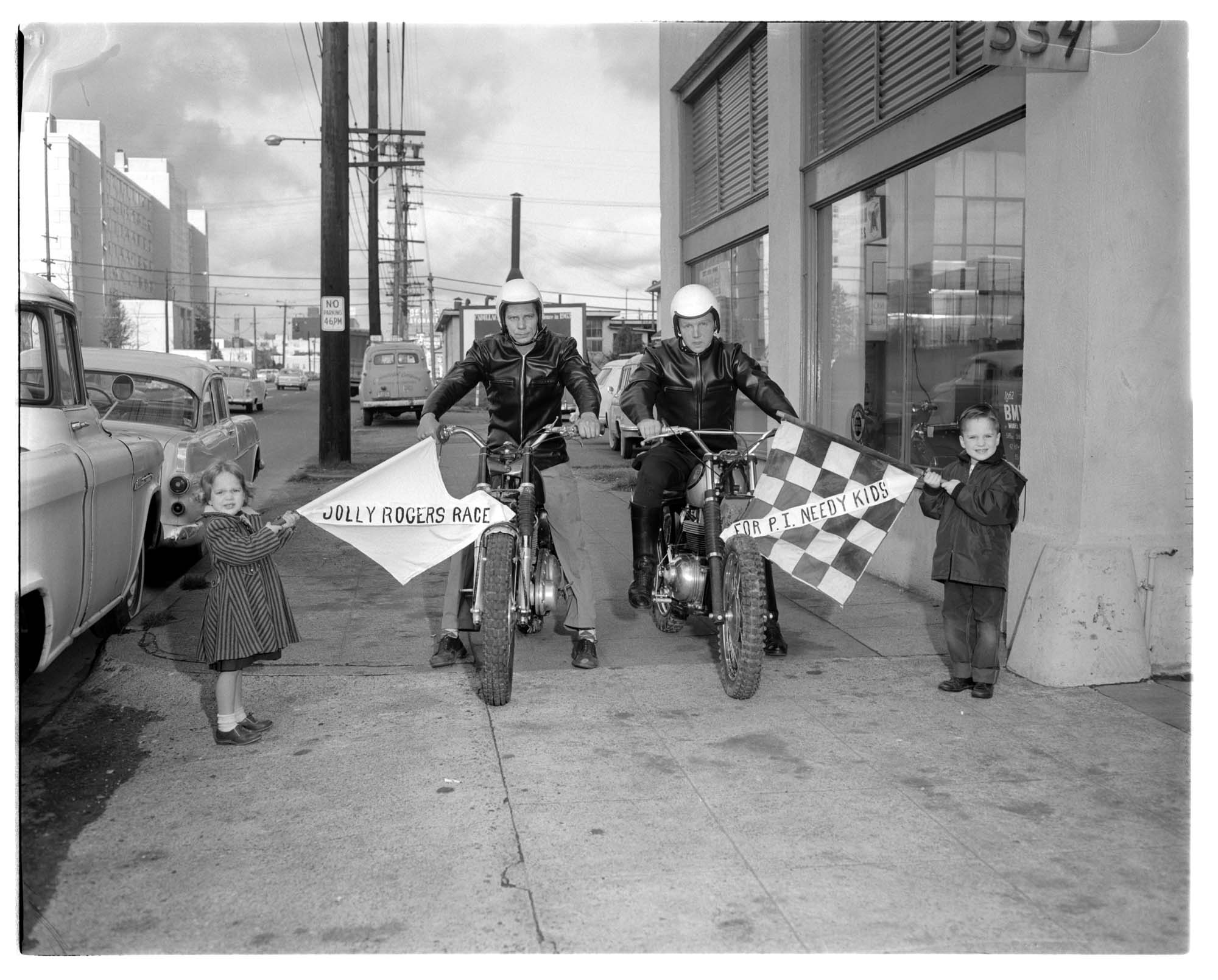 Image of Motorcyclists posing with children for charity race promotion, Seattle, 1962