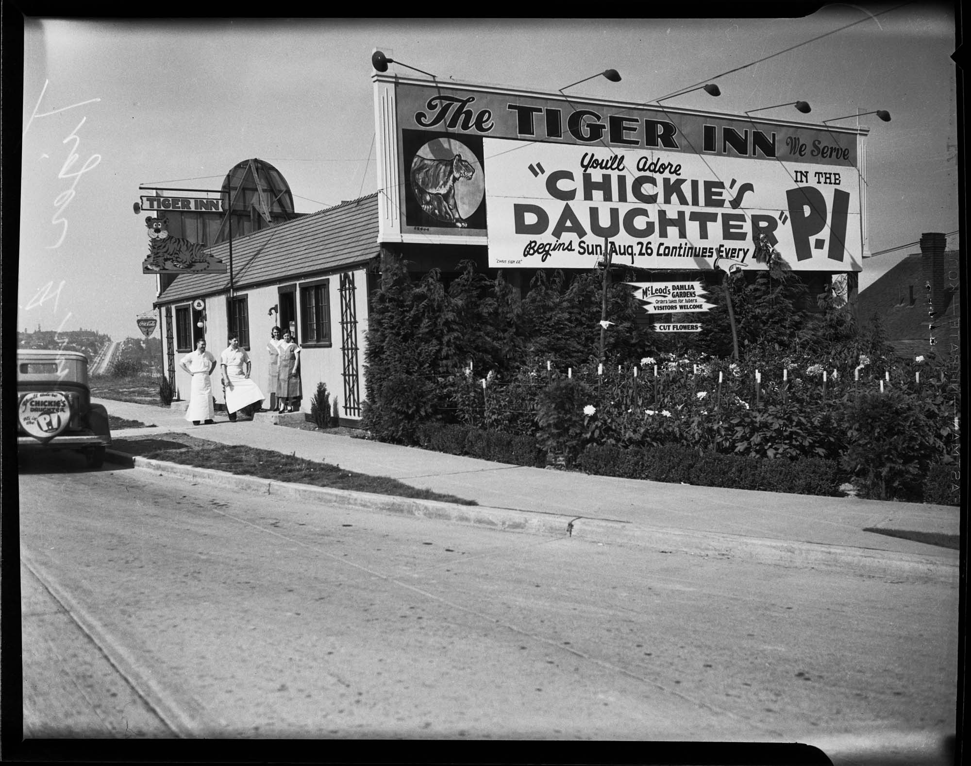 Image of Tiger Inn Restaurant exterior with employees, 1947