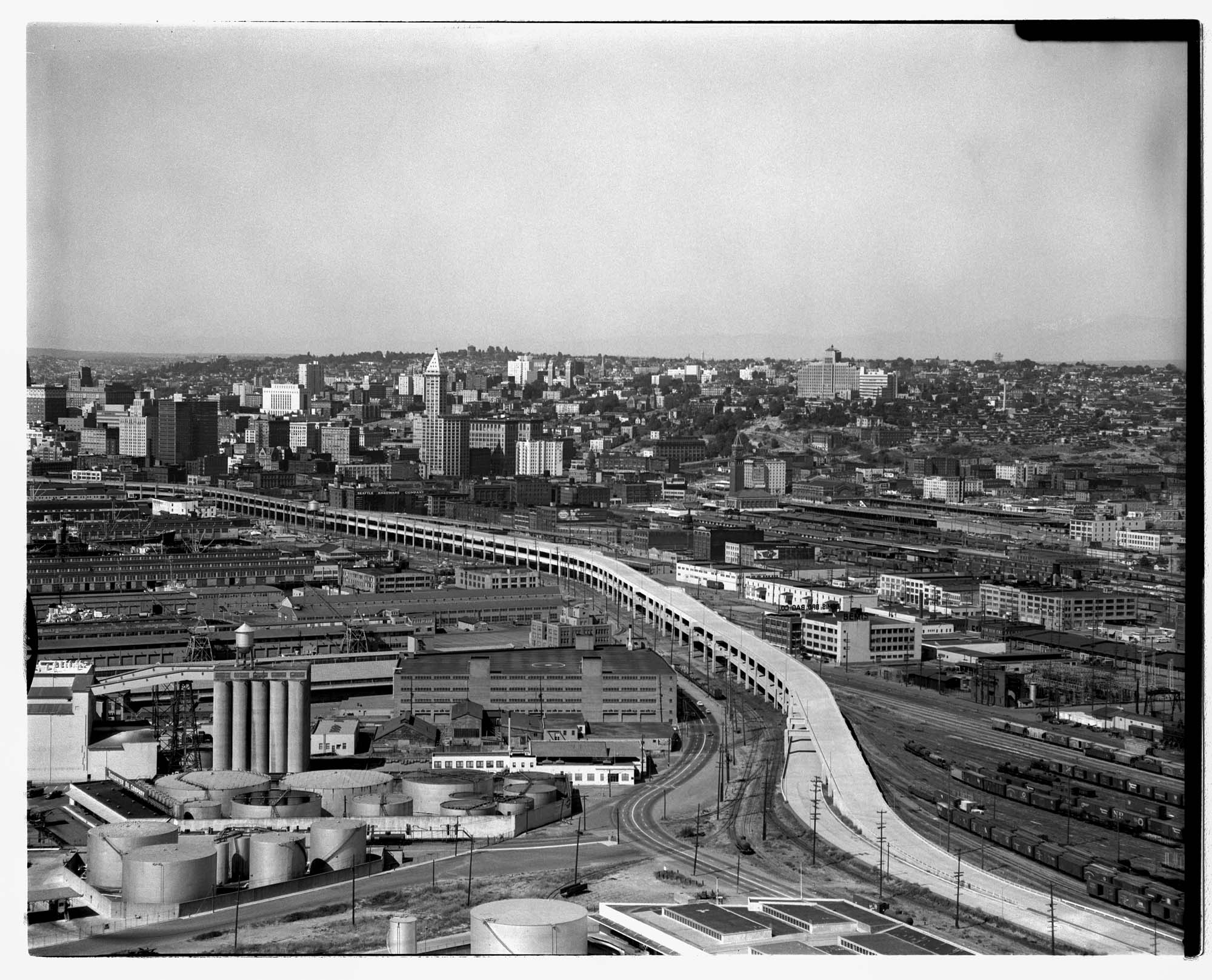 Image of Aerial of Alaskan Way Viaduct extension south to Spokane Street with a view northeast toward Seattle, 1959
