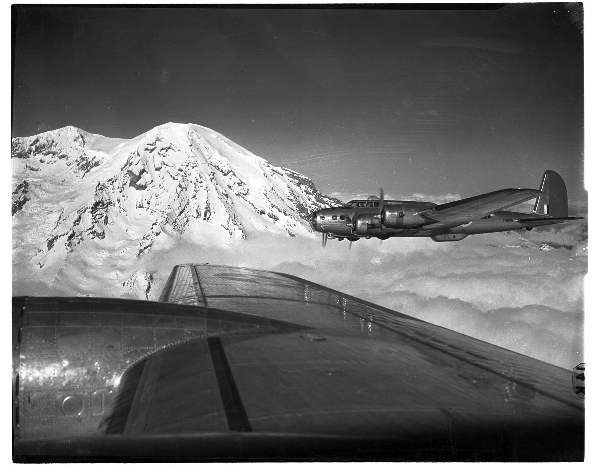 Image of Boeing bomber B-17 in flight with Mount Rainier in the background, 1941