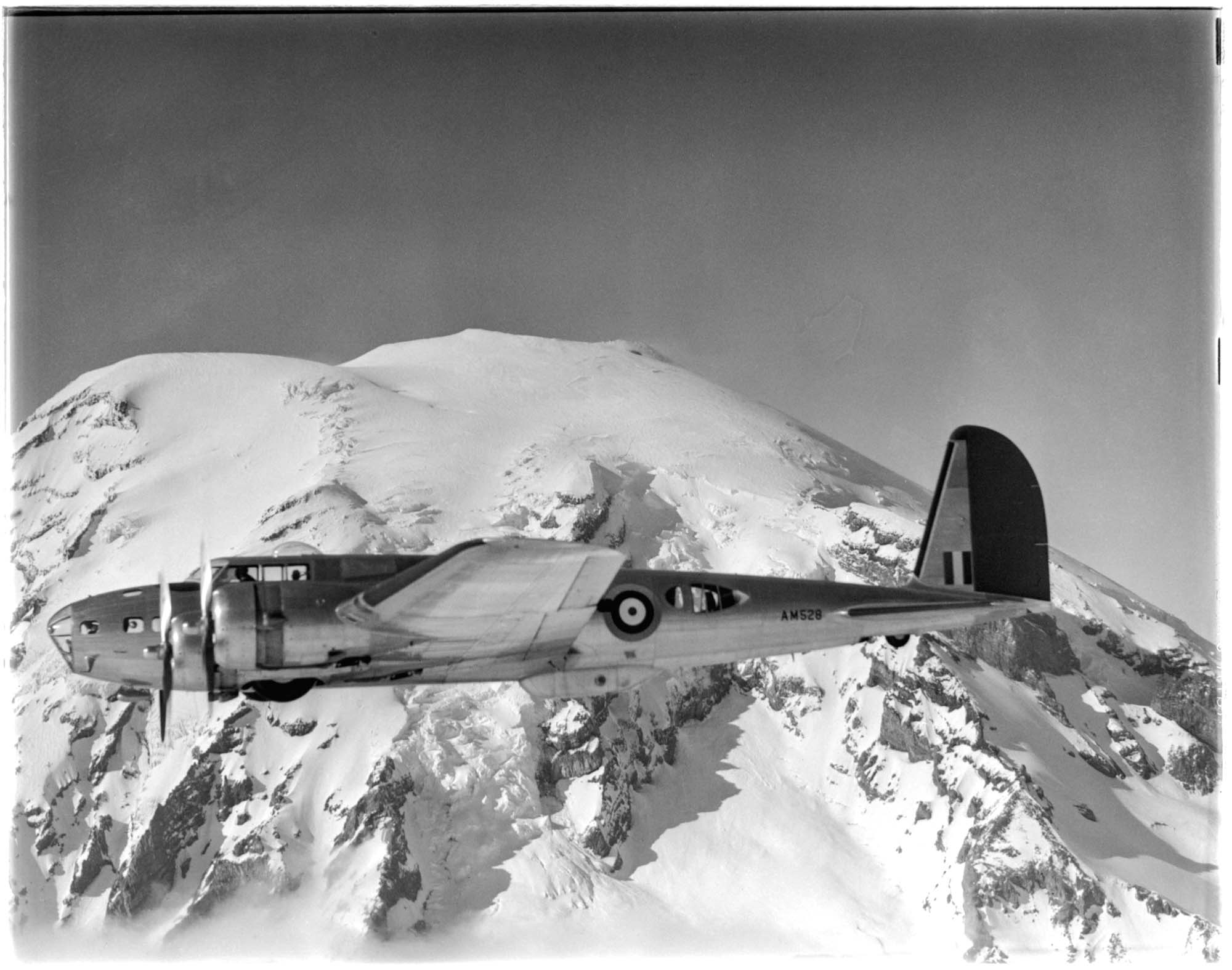Image of Boeing bomber B-17 in flight with Mount Rainier in the background, 1941