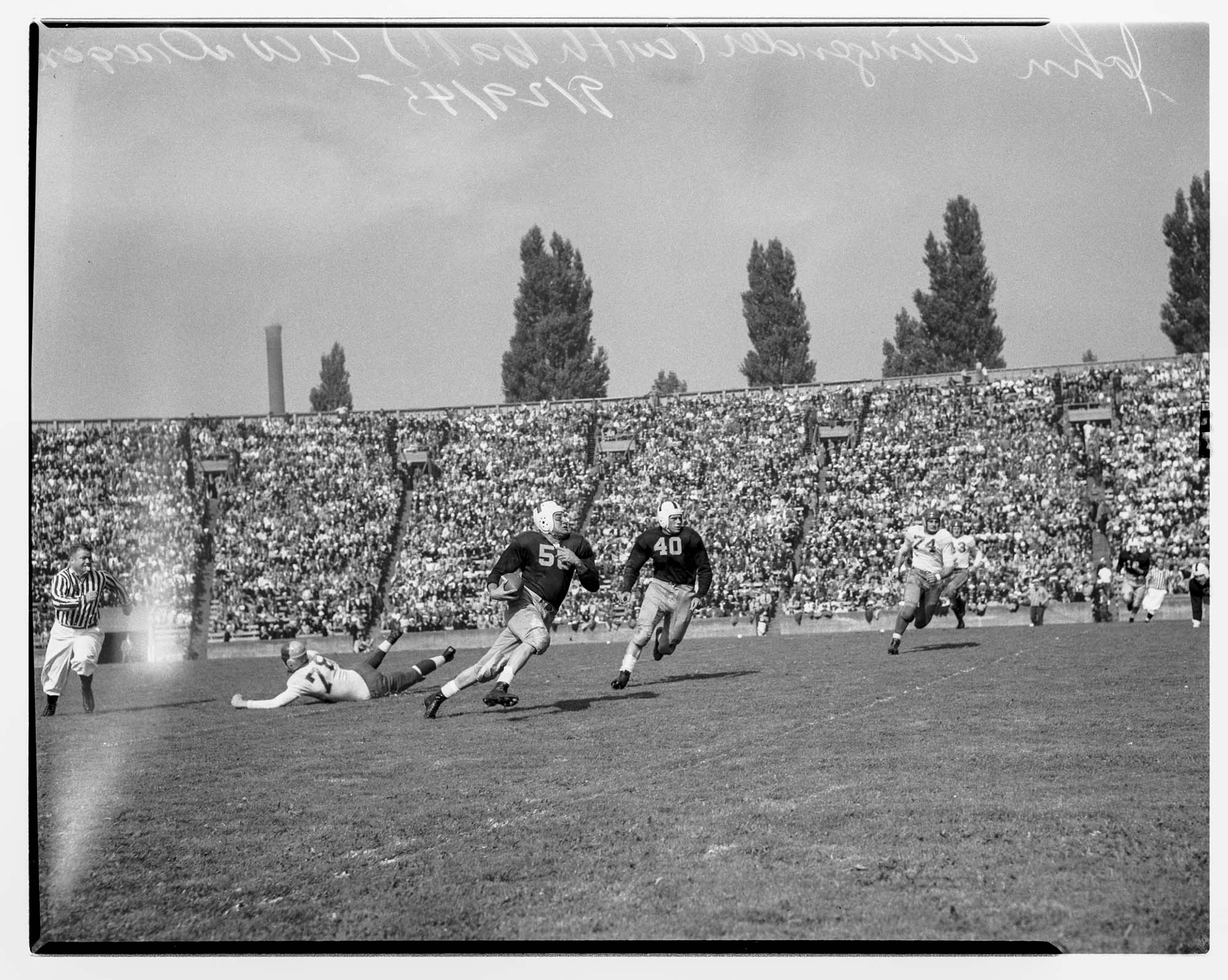 Image of Players in University of Washington vs. University of Oregon football game at Husky Stadium, Seattle, September 29, 1945