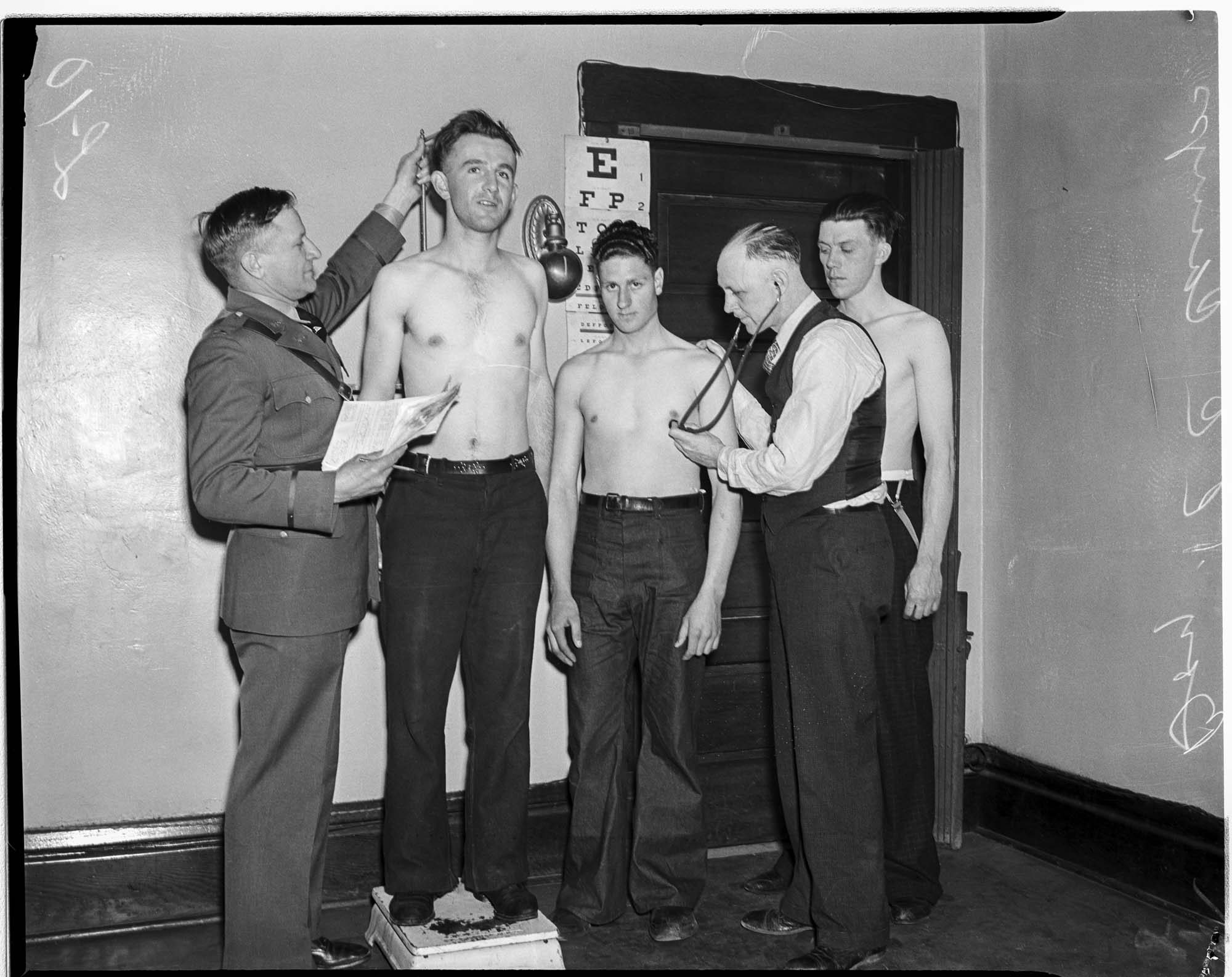 Image of Young men in the Civilian Conservation Corps receiving a physical exam, 1937
