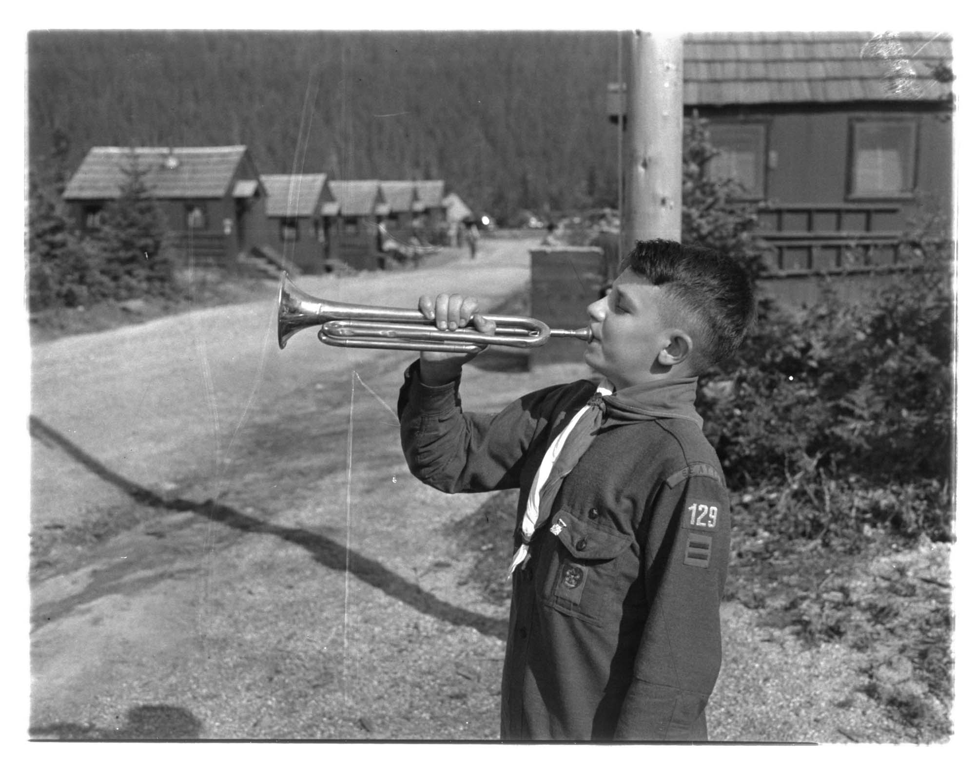 Image of Young bugler at a Civilian Conservation Corps camp, 1939