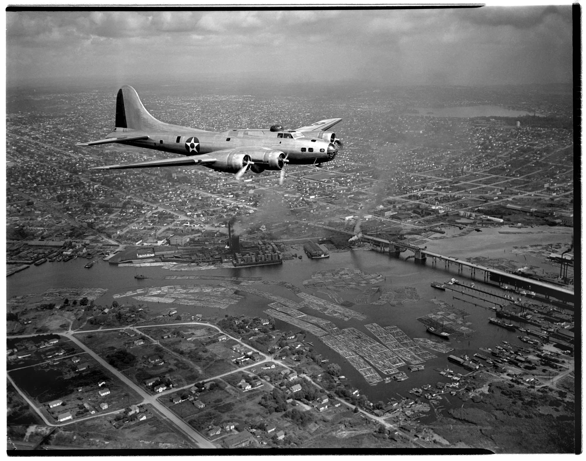 Image of Aerial view of an early Boeing B-17E in flight, Seattle, 1941