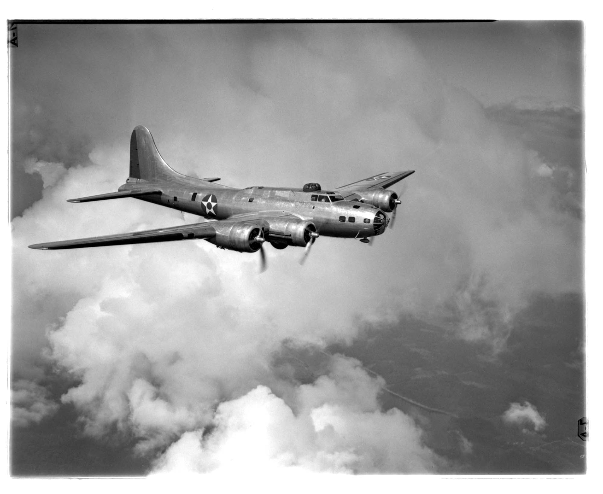 Image of Aerial view of an early Boeing B-17E in flight, Washington State, 1941