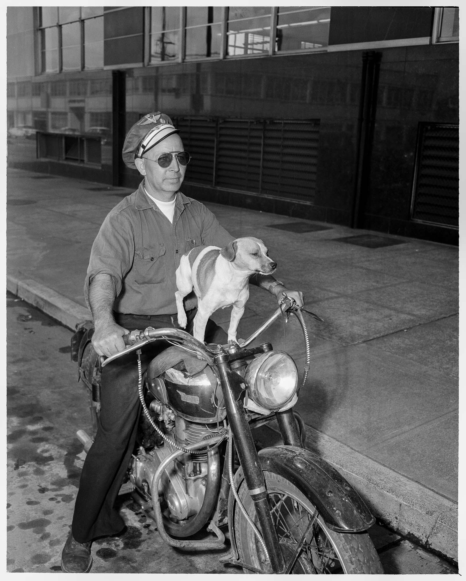 Image of Gale Dresden and his dog Toughy on a motorcycle, June 29, 1958