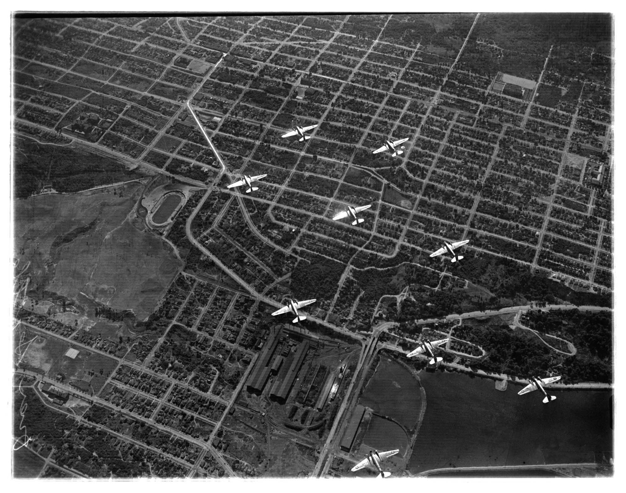 Image of Aerial view looking down on nine Martin bombers in formation, 1938